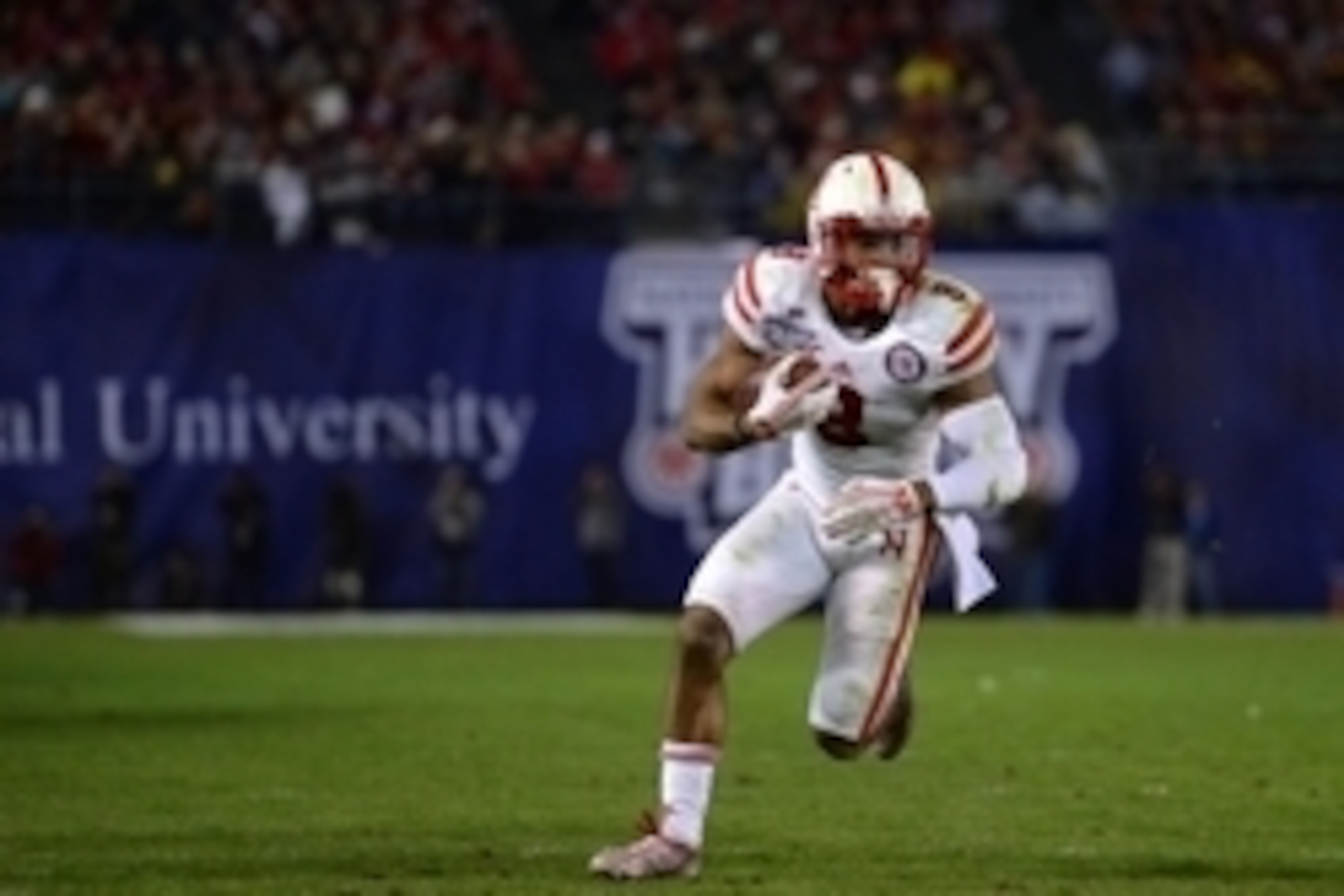 Dec 27, 2014; San Diego, CA, USA; Nebraska Cornhuskers running back Ameer Abdullah (8) runs during the third quarter against the USC Trojans in the 2014 Holiday Bowl at Qualcomm Stadium. Mandatory Credit: Jake Roth-USA TODAY Sports