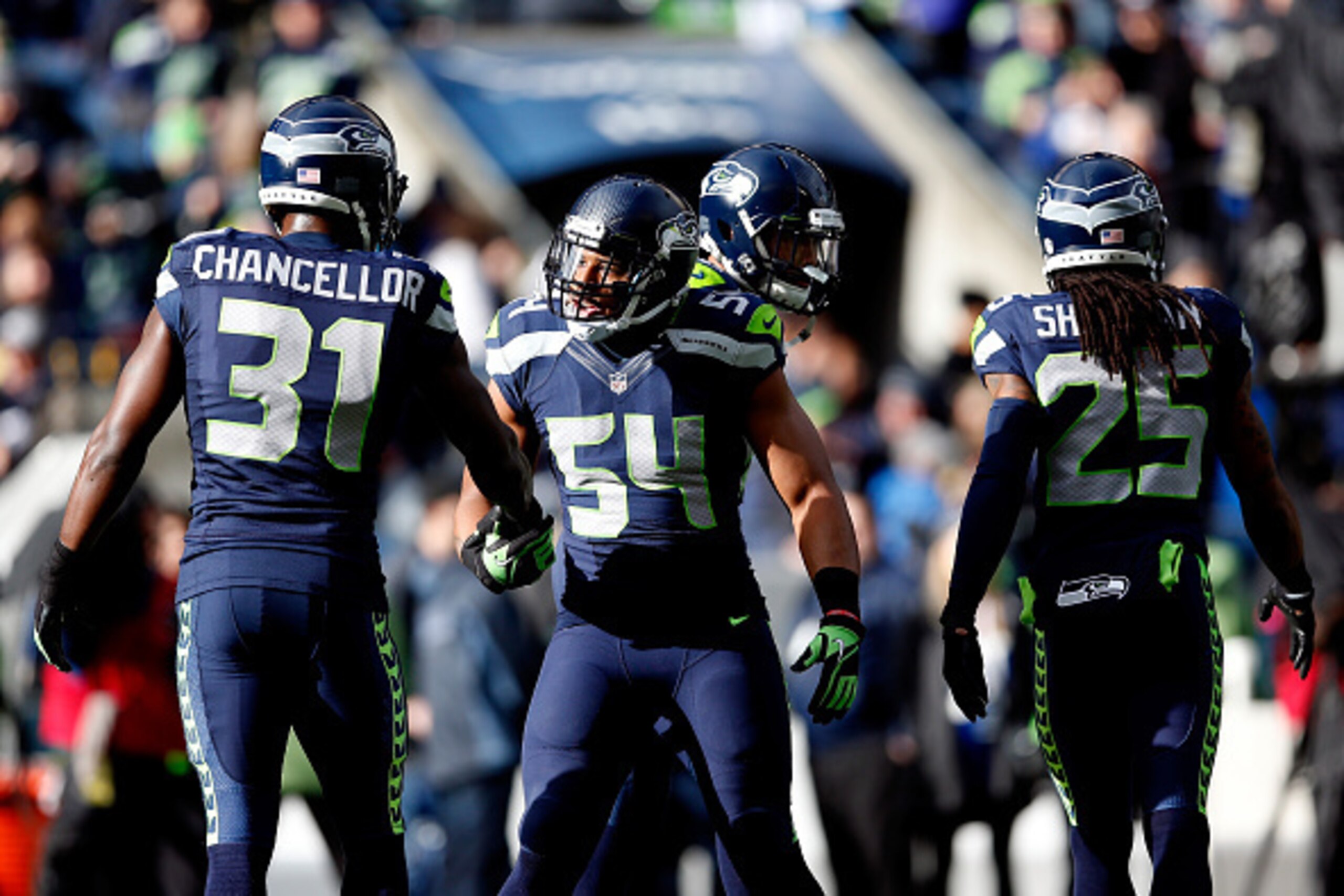 SEATTLE, WA - JANUARY 18:   Bobby Wagner #54 shakes hands with  Kam Chancellor #31 of the Seattle Seahawks before the 2015 NFC Championship game at CenturyLink Field on January 18, 2015 in Seattle, Washington.  (Photo by Christian Petersen/Getty Images)