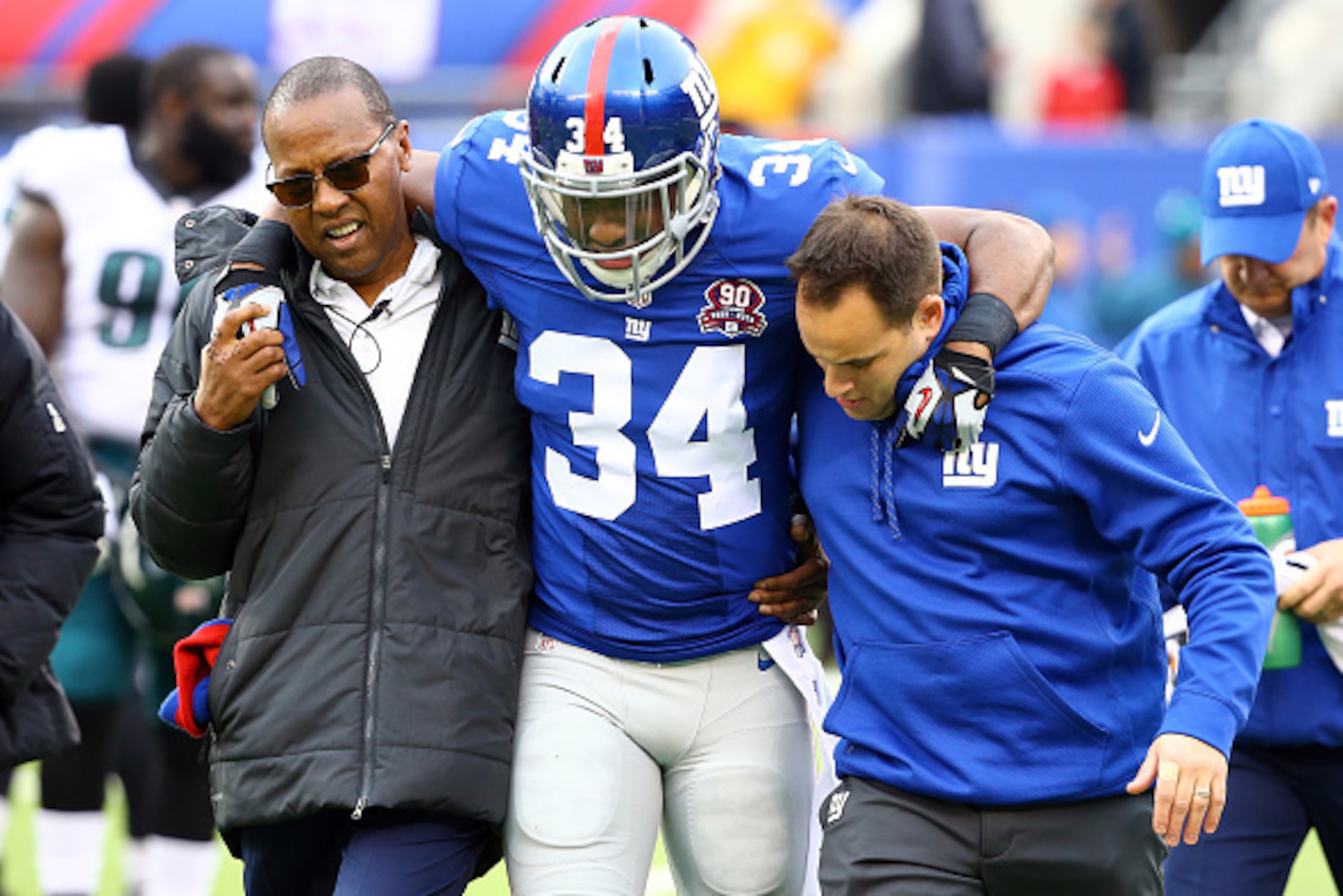 EAST RUTHERFORD, NJ - DECEMBER 28:  Nat Berhe #34 of the New York Giants is helped off the field after an injury against the Philadelphia Eagles during a game at MetLife Stadium on December 28, 2014 in East Rutherford, New Jersey.  (Photo by Al Bello/Gett