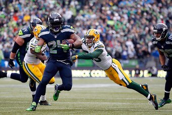 SEATTLE, WA - JANUARY 18:  Marshawn Lynch #24 of the Seattle Seahawks runs the ball in for a touchdown during the fourth quarter of the 2015 NFC Championship game against the Green Bay Packers at CenturyLink Field on January 18, 2015 in Seattle, Washingto