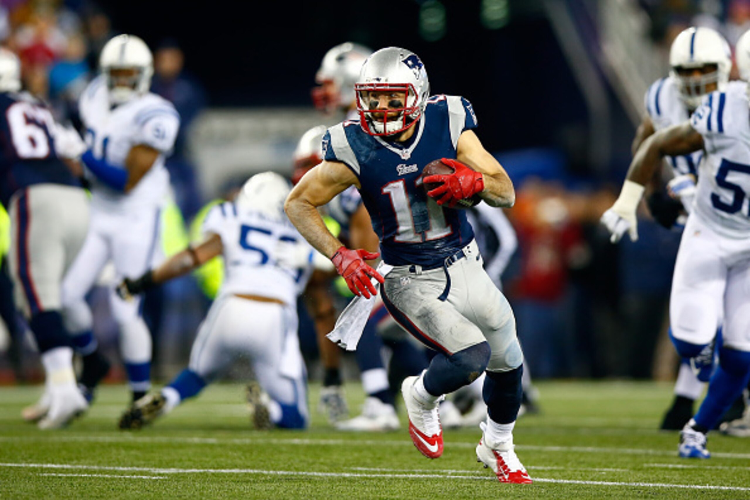 FOXBORO, MA - JANUARY 18:  Julian Edelman #11 of the New England Patriots runs with the ball in the first half against the Indianapolis Colts of the 2015 AFC Championship Game at Gillette Stadium on January 18, 2015 in Foxboro, Massachusetts.  (Photo by J