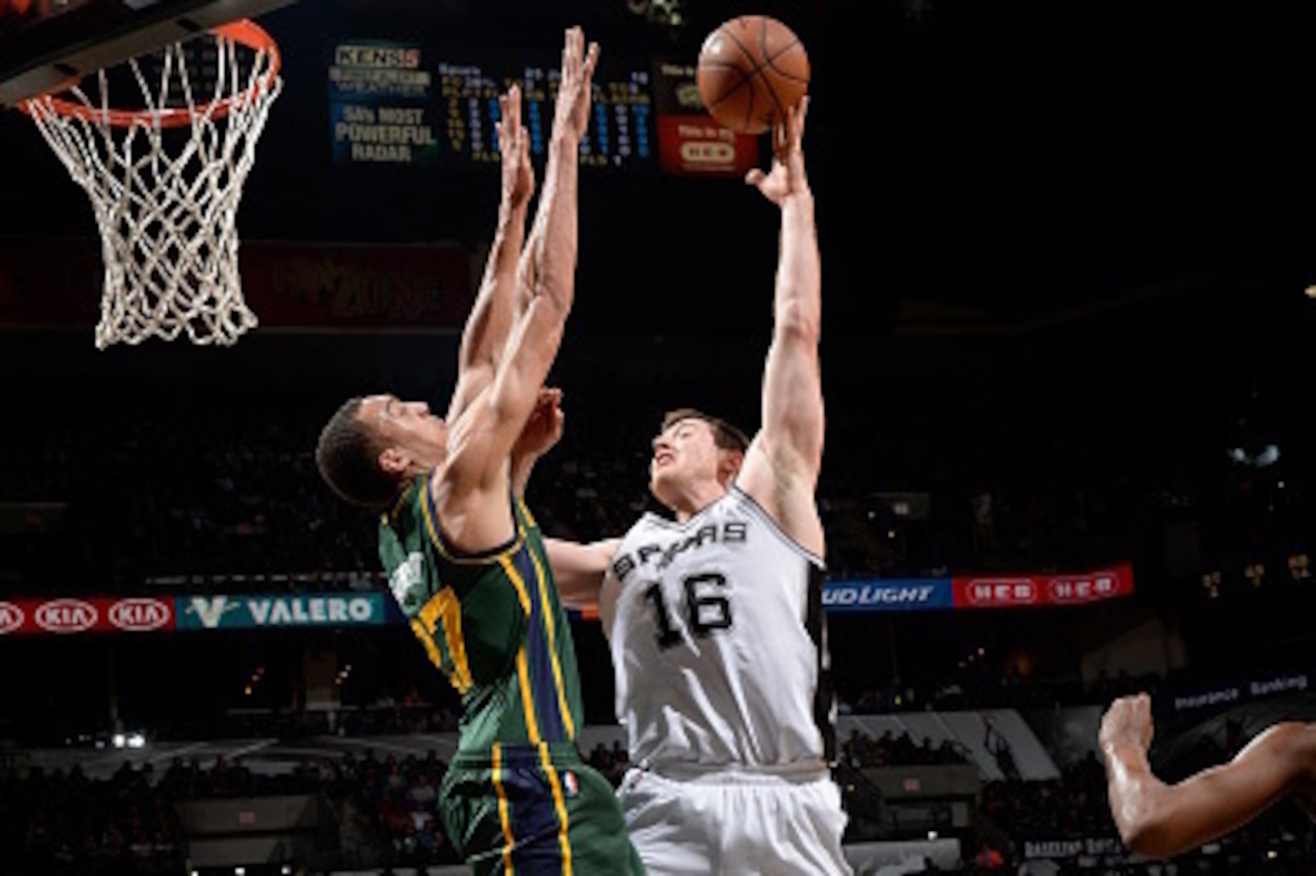 SAN ANTONIO - January 18: Aron Baynes #16 of the San Antonio Spurs takes a shot against the Utah Jazz at the AT&T Center on January 18, 2014 in San Antonio, Texas. NOTE TO USER: User expressly acknowledges and agrees that, by downloading and or using this