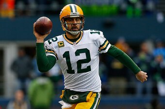 SEATTLE, WA - JANUARY 18: Aaron Rodgers #12 of the Green Bay Packers passes the ball during the second half of the 2015 NFC Championship game against the Seattle Seahawks at CenturyLink Field on January 18, 2015 in Seattle, Washington.  (Photo by Tom Penn