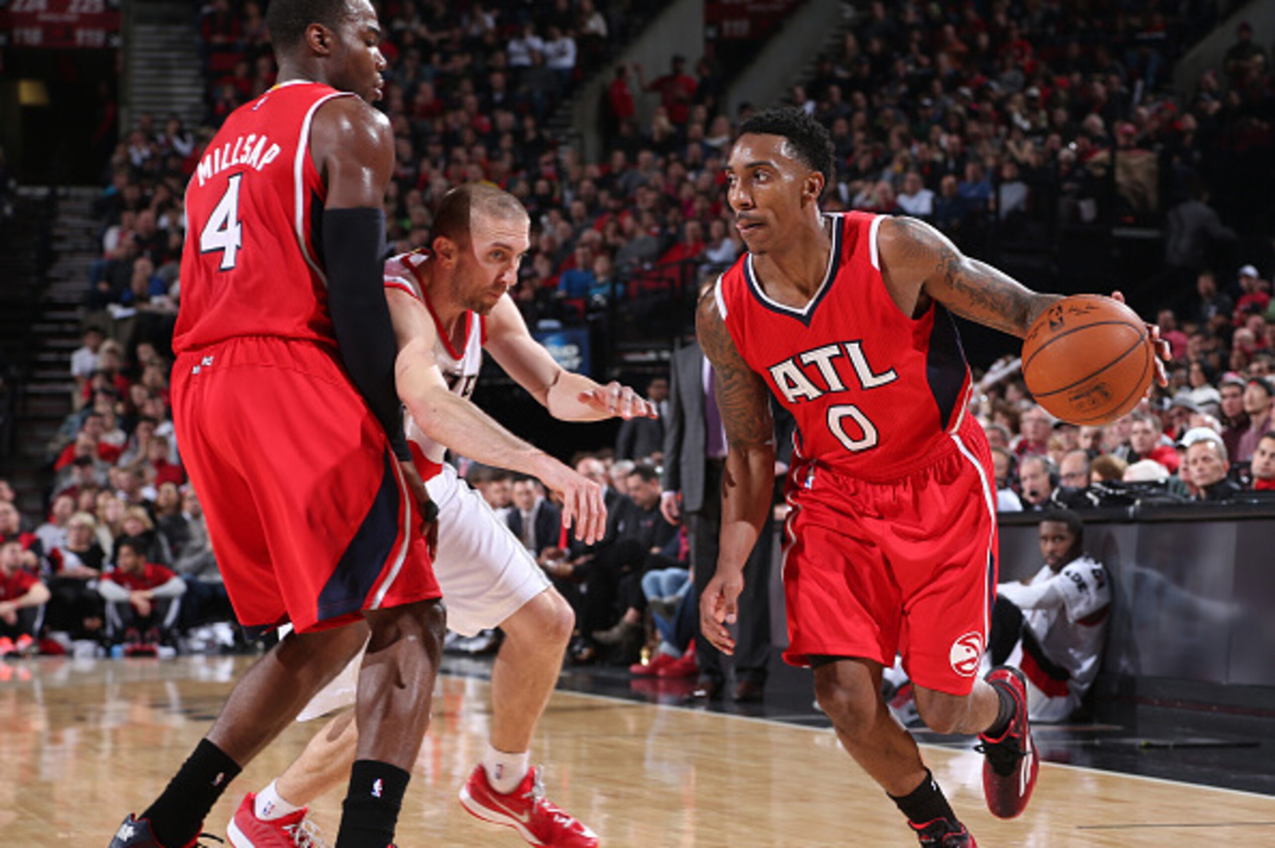 PORTLAND, OR - JANUARY 3:  Jeff Teague #0 of the Atlanta Hawks handles the ball against the Portland Trail Blazers on January 3, 2015 at the Moda Center Arena in Portland, Oregon. NOTE TO USER: User expressly acknowledges and agrees that, by downloading a