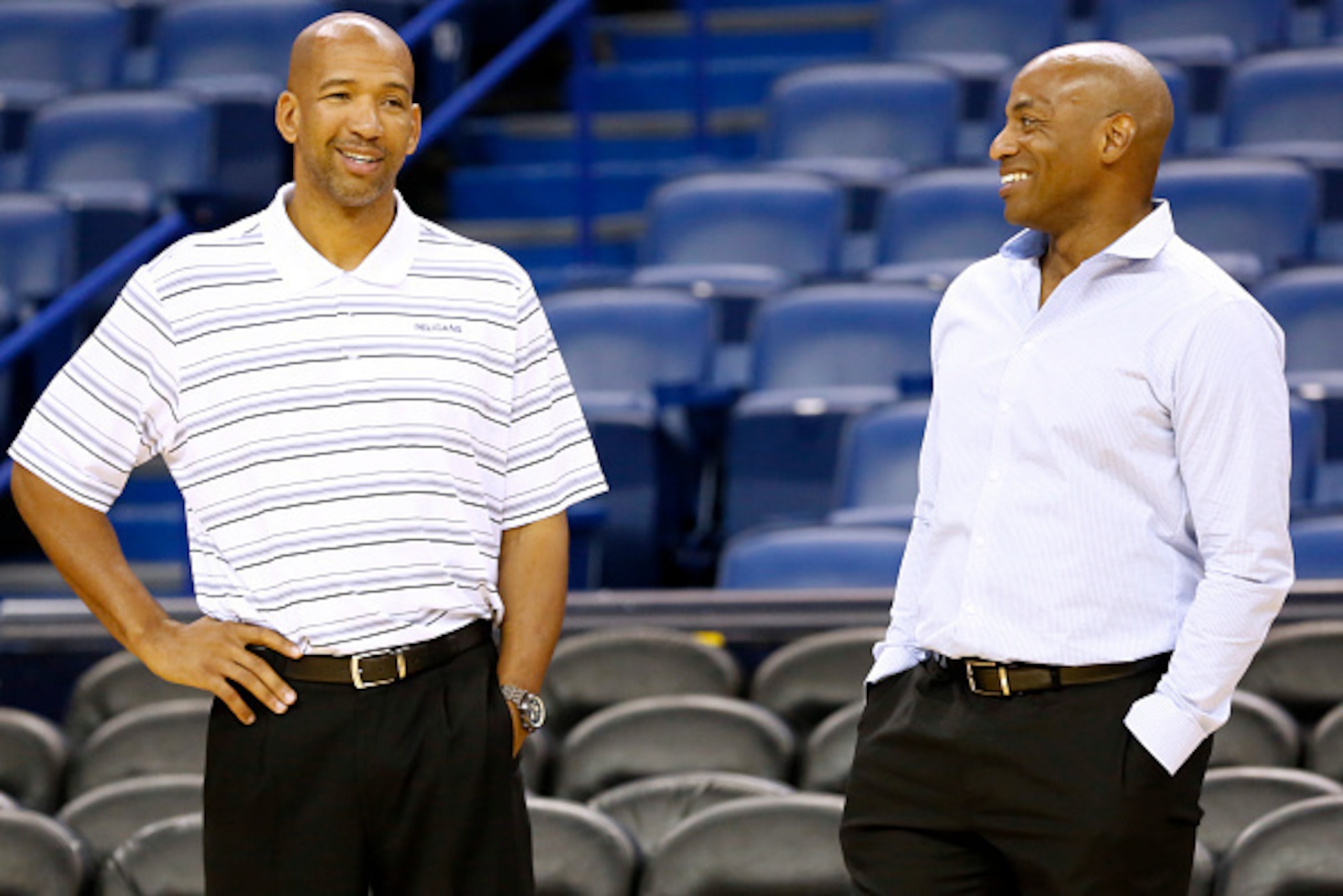 NEW ORLEANS, LA - OCTOBER 16:  Head coach Monty Williams (L) and General Manager Dell Demps of the New Orleans Pelicans talk during an open practice for fans on October 25, 2014 at the Smoothie King Center in New Orleans, Louisiana. NOTE TO USER: User exp