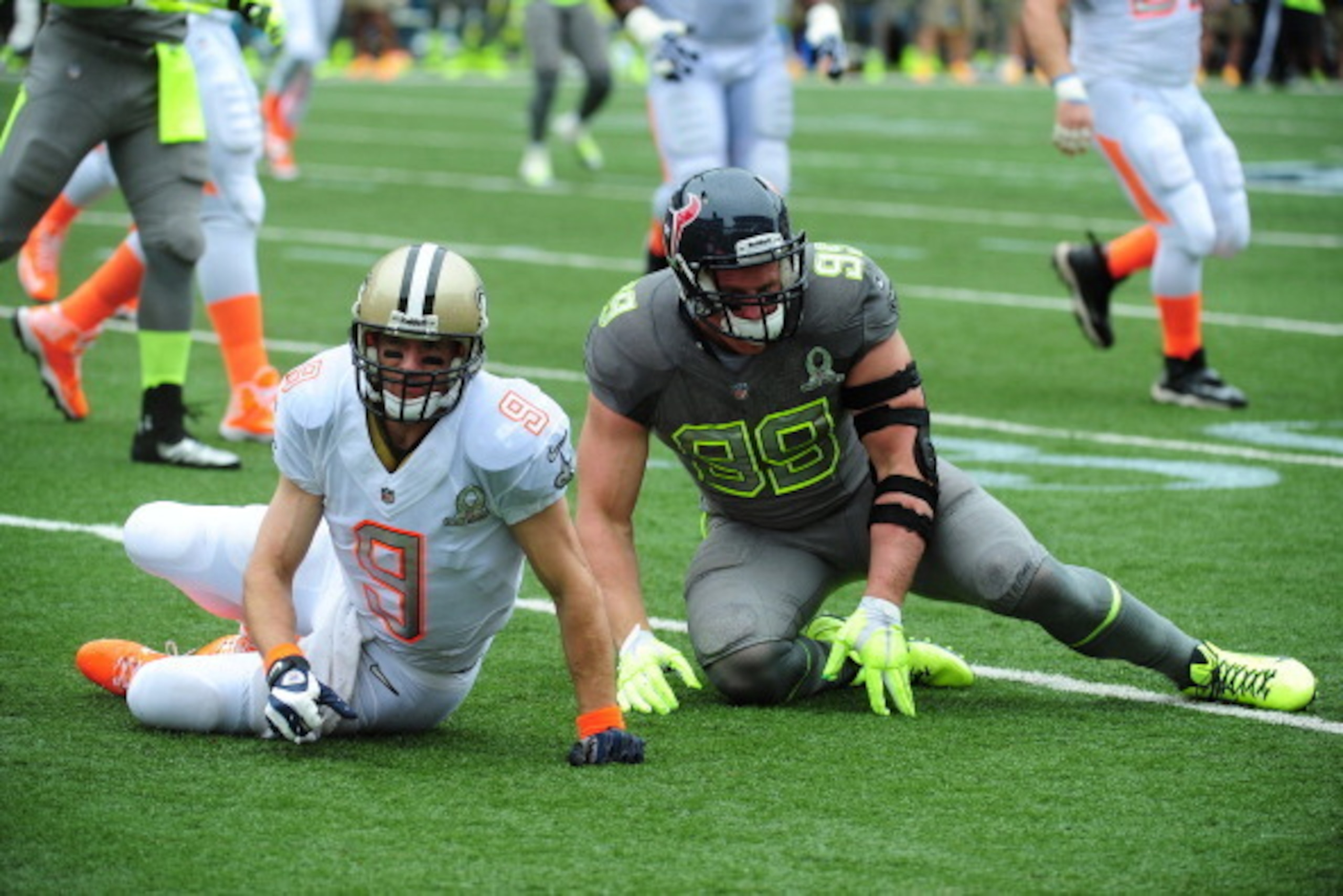 HONOLULU, HI - JANUARY 26: Drew Brees #9 of the New Orleans Saints and Team Rice is hit by J. J. Watt #99 of the Houston Texans and Team Sanders during the 2014 Pro Bowl at Aloha Stadium on January 26, 2014 in Honolulu, Hawaii  (Photo by Scott Cunningham/