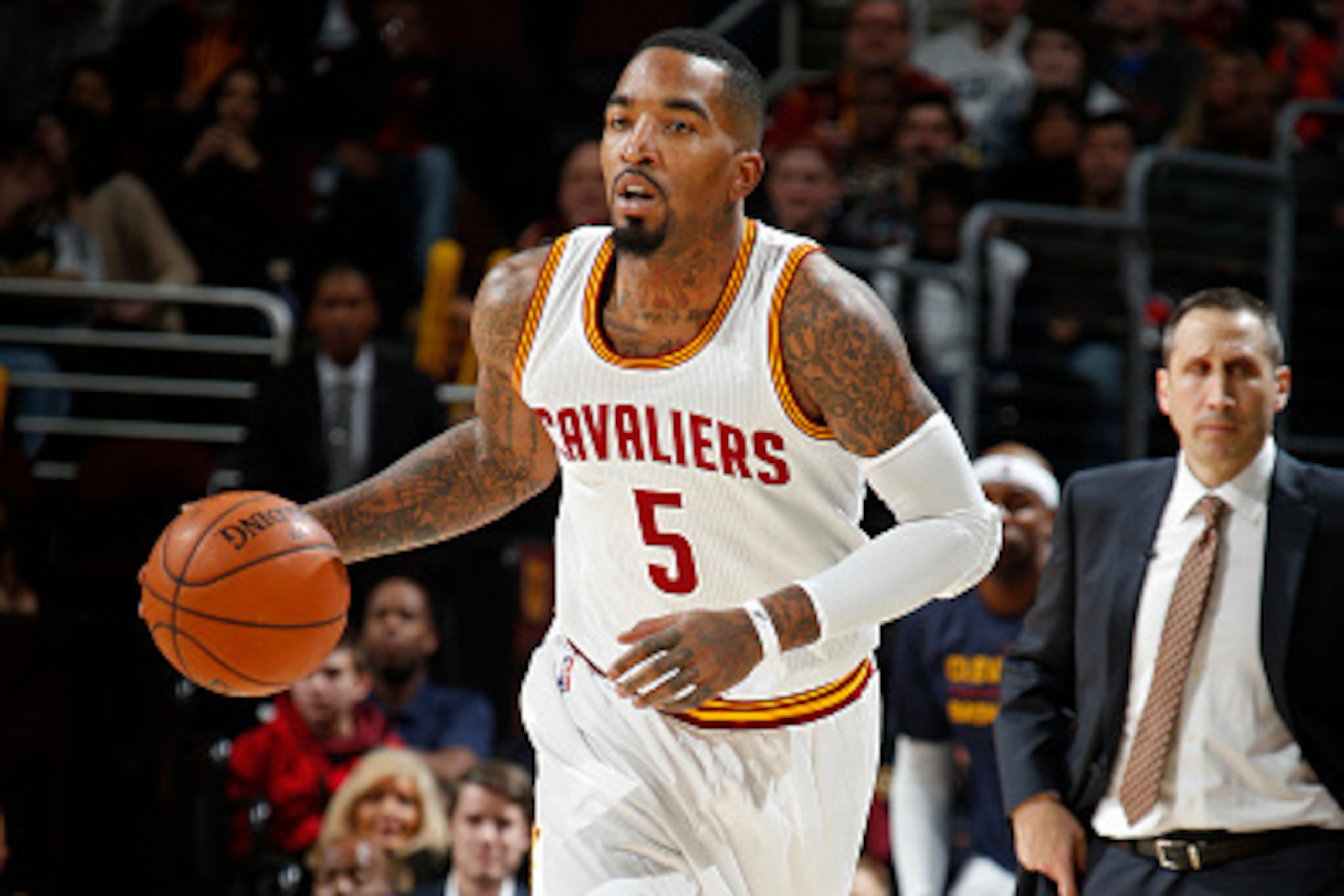CLEVELAND, OH - JANUARY 7:  J.R. Smith #5 of the Cleveland Cavaliers brings the ball up court against the Houston Rockets on January 7, 2015 at Quicken Loans Arena in Cleveland, Ohio. NOTE TO USER: User expressly acknowledges and agrees that, by downloadi