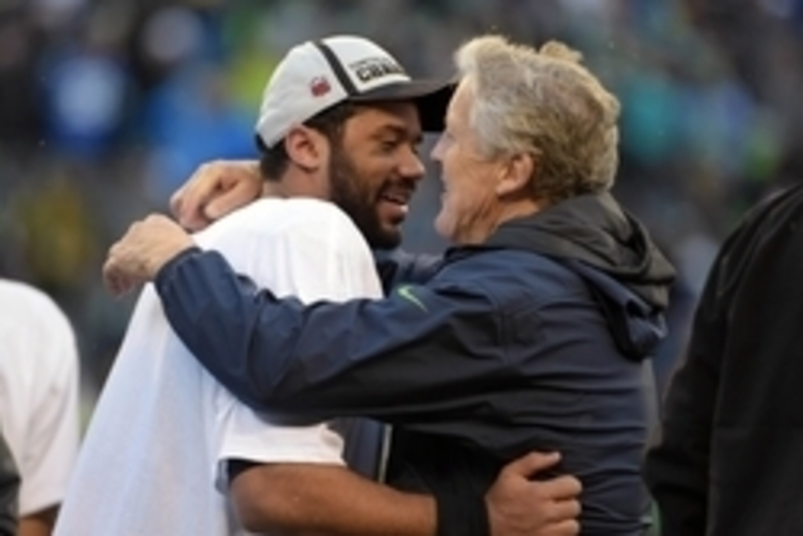Jan 18, 2015; Seattle, WA, USA; Seattle Seahawks quarterback Russell Wilson (left) and head coach Pete Carroll celebrate on the podium following the victory over the Green Bay Packers in the NFC Championship Game at CenturyLink Field. The Seahawks defeate Jan 18, 2015; Seattle, WA, USA; Seattle Seahawks quarterback Russell Wilson (left) and head coach Pete Carroll celebrate on the podium following the victory over the Green Bay Packers in the NFC Championship Game at CenturyLink Field. The Seahawks defeate