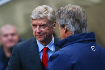 MANCHESTER, ENGLAND - JANUARY 18:  Manuel Pellegrini manager of Manchester City and Arsene Wenger manager of Arsenal shake hands prior to the Barclays Premier League match between Manchester City and Arsenal at Etihad Stadium on January 18, 2015 in Manche