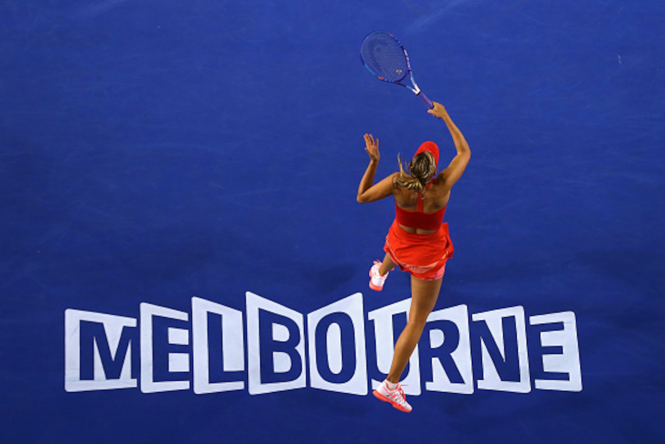 MELBOURNE, AUSTRALIA - JANUARY 19:  Maria Sharapova of Russia plays a forehand in her first round match against Petra Martic of Croatia during day one of the 2015 Australian Open at Melbourne Park on January 19, 2015 in Melbourne, Australia.  (Photo by Ry