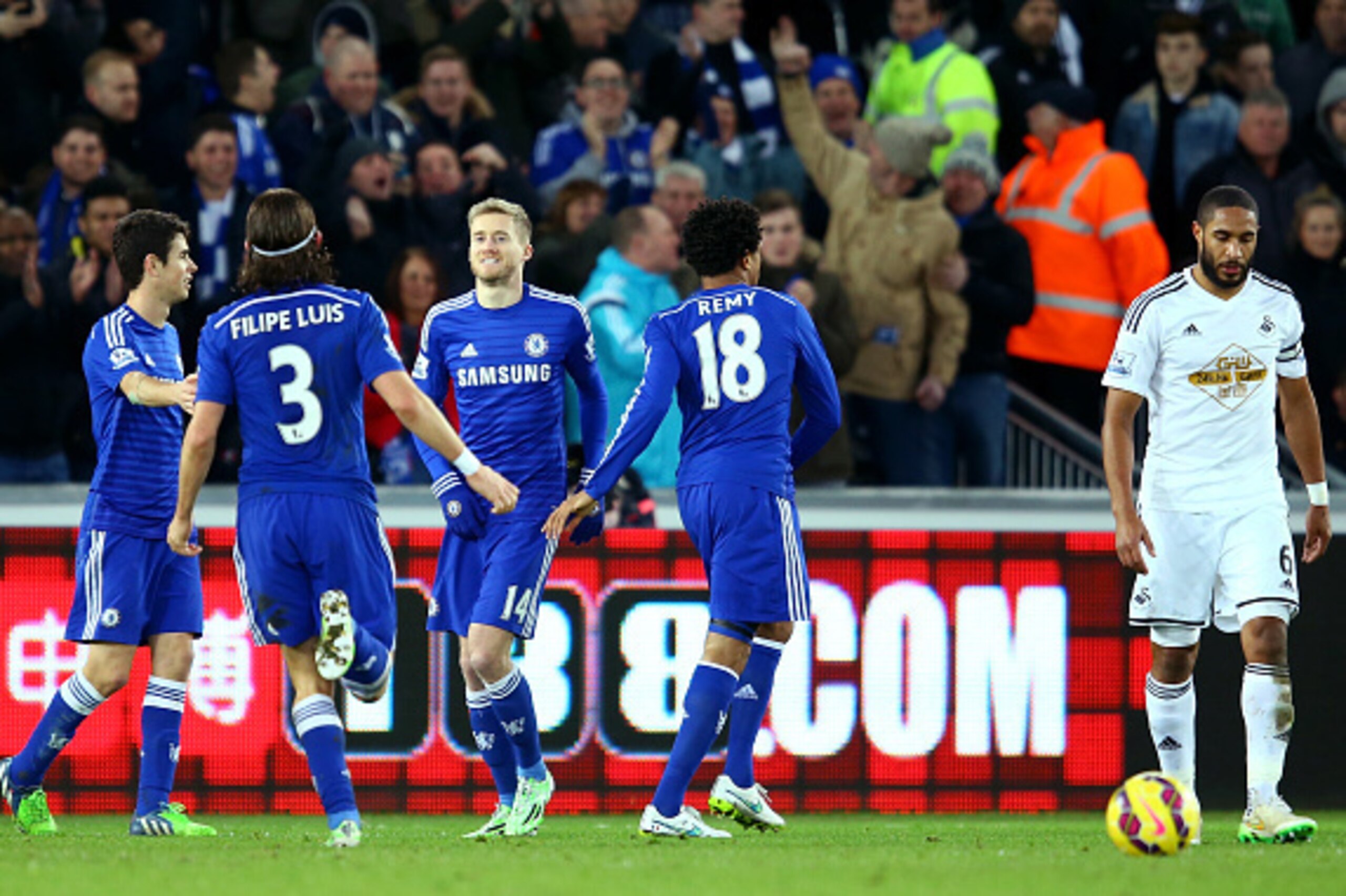 SWANSEA, WALES - JANUARY 17:  Andre Schurrle of Chelsea (3rd L) celebrates with team-mates after scoring the team's fifth goal during the Barclays Premier League match between Swansea City and Chelsea at Liberty Stadium on January 17, 2015 in Swansea, Wal