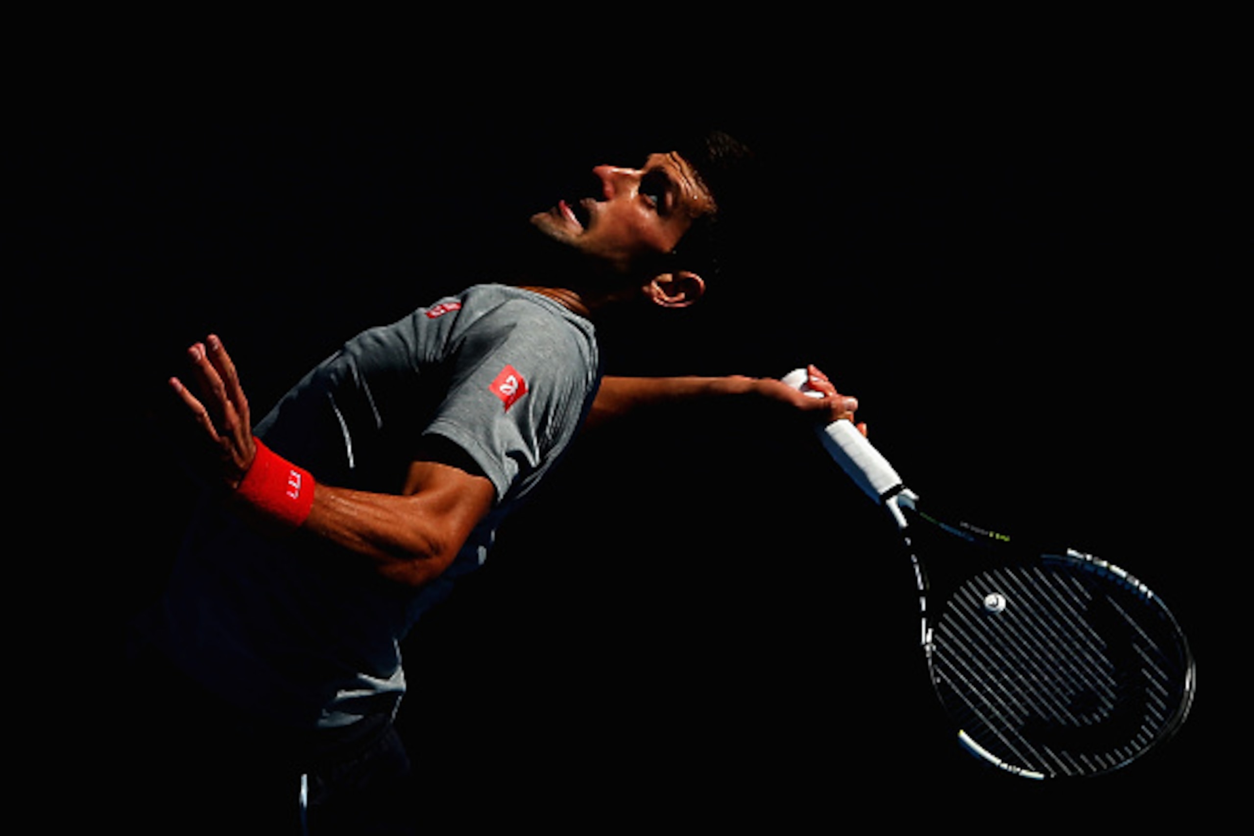 MELBOURNE, AUSTRALIA - JANUARY 18:  Novak Djokovic of Serbia serves during a practice session ahead of the 2015 Australian Open at Melbourne Park on January 18, 2015 in Melbourne, Australia.  (Photo by Quinn Rooney/Getty Images)