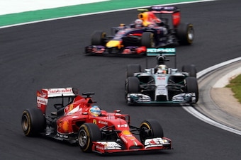 BUDAPEST, HUNGARY - JULY 27:  Fernando Alonso of Spain and Ferrari, Lewis Hamilton of Great Britain and Mercedes GP and Daniel Ricciardo of Australia and Infiniti Red Bull Racing drive during the Hungarian Formula One Grand Prix at Hungaroring on July 27,