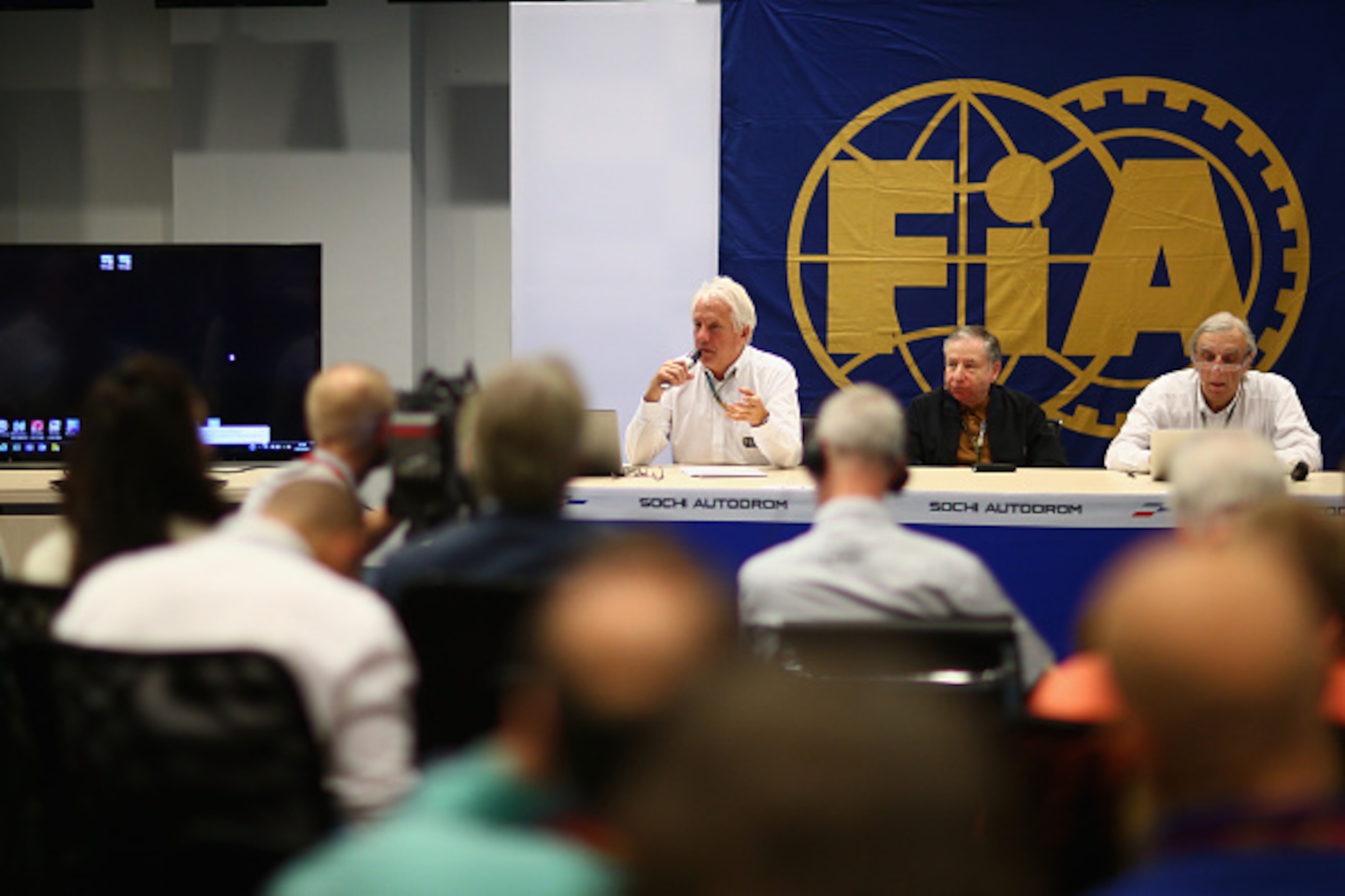 SOCHI, RUSSIA - OCTOBER 10:  (L-R) FIA Race Director Charlie Whiting, FIA President Jean Todt and Chief Medical Officer Jean-Charles Piette attend a FIA press briefing regarding the Japanese Grand Prix after practice ahead of the Russian Formula One Grand