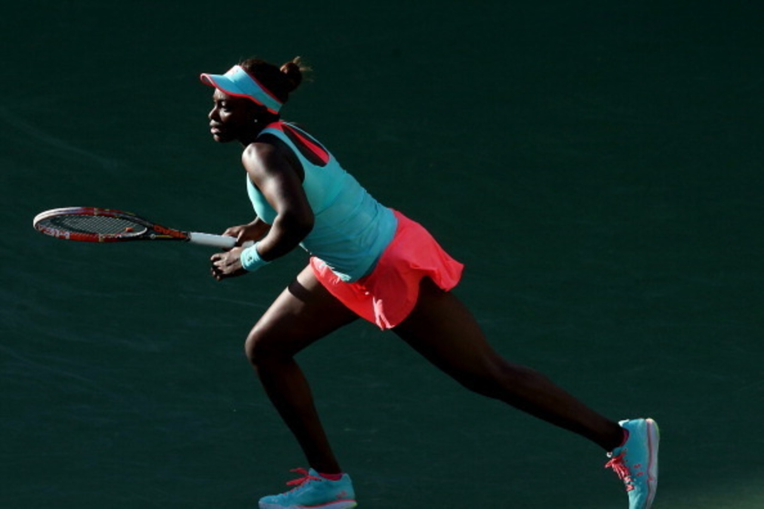 INDIAN WELLS, CA - MARCH 13: Sloane Stephens chases a shot from Flavia Pennetta of Italy during the BNP Paribas Open at Indian Wells Tennis Garden on March 13, 2014 in Indian Wells, California. (Photo by Stephen Dunn/Getty Images) INDIAN WELLS, CA - MARCH 13: Sloane Stephens chases a shot from Flavia Pennetta of Italy during the BNP Paribas Open at Indian Wells Tennis Garden on March 13, 2014 in Indian Wells, California. (Photo by Stephen Dunn/Getty Images)