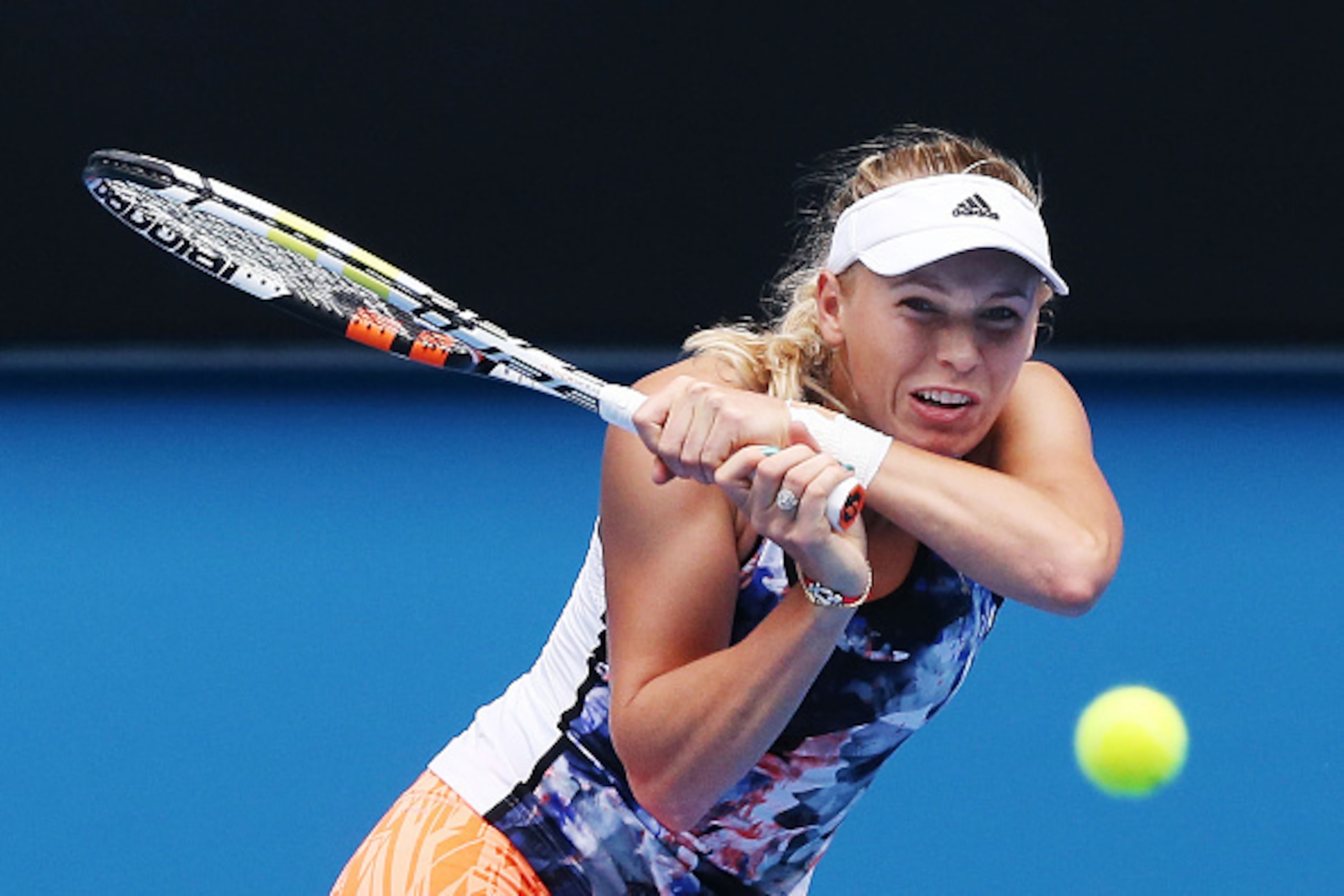 MELBOURNE, AUSTRALIA - JANUARY 18: Caroline Wozniacki of Denmark hits a backhand during a practice session ahead of the 2015 Australian Open at Melbourne Park on January 18, 2015 in Melbourne, Australia. (Photo by Michael Dodge/Getty Images) MELBOURNE, AUSTRALIA - JANUARY 18: Caroline Wozniacki of Denmark hits a backhand during a practice session ahead of the 2015 Australian Open at Melbourne Park on January 18, 2015 in Melbourne, Australia. (Photo by Michael Dodge/Getty Images)