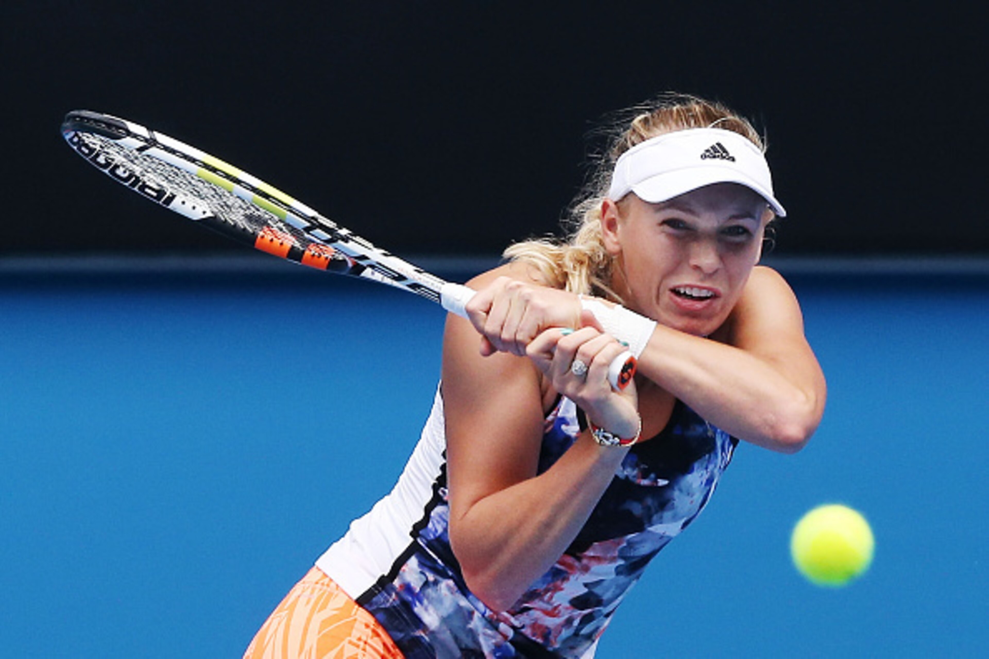 MELBOURNE, AUSTRALIA - JANUARY 18:  Caroline Wozniacki of Denmark hits a backhand during a practice session ahead of the 2015 Australian Open at Melbourne Park on January 18, 2015 in Melbourne, Australia.  (Photo by Michael Dodge/Getty Images)