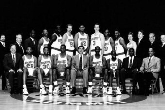 HOUSTON - 1994: The 1993-94 NBA Houston Rockets pose for a team portrait at the Summit in Houston, TX. Front row (left to right): Carroll Dawson (Asst. Coach), Robert Horry, Kenny Smith, Otis Thorpe, Rudy Tomjanovich (Head Coach), Hakeem Olajuwon, Vernon 