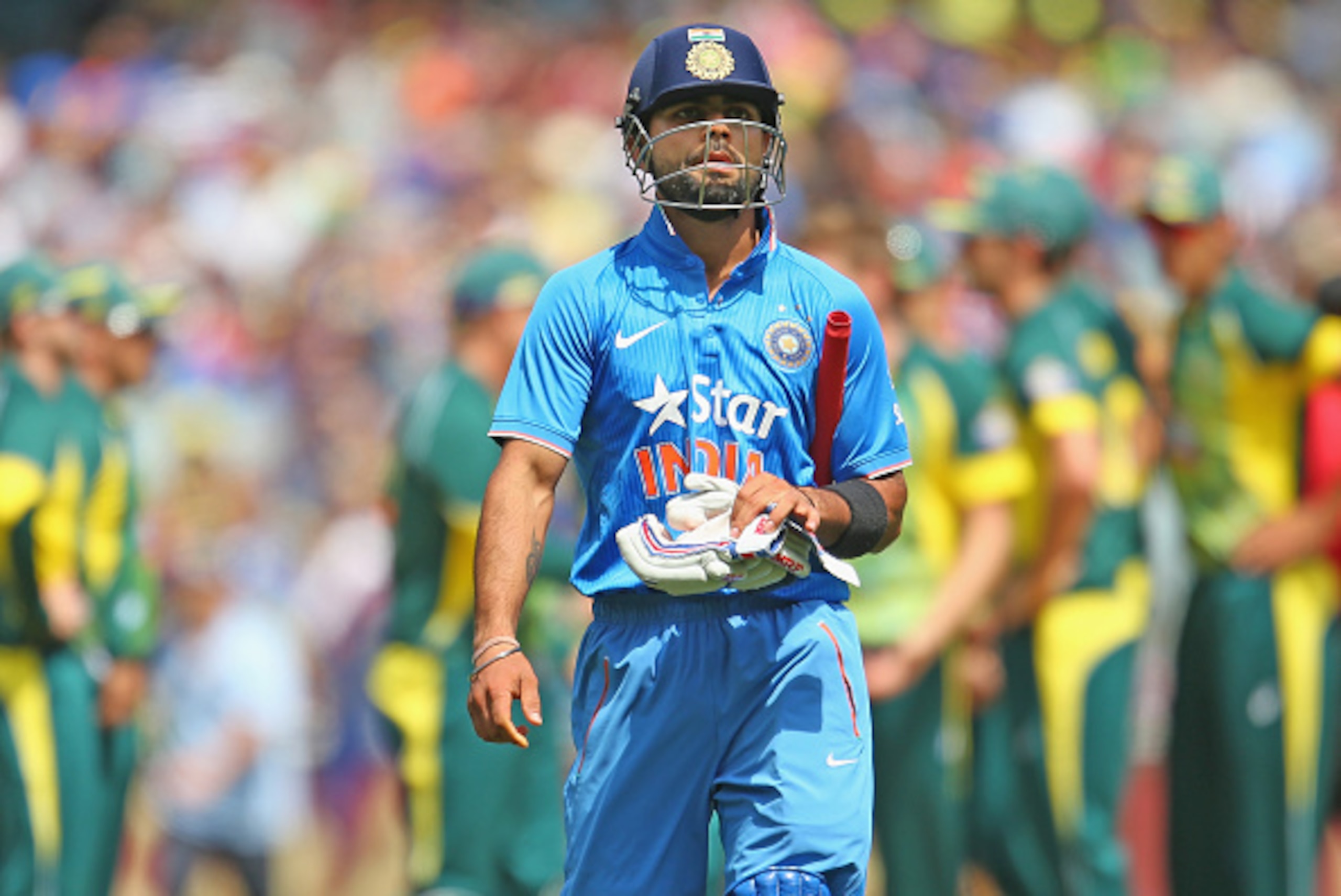 MELBOURNE, AUSTRALIA - JANUARY 18: Virat Kohli of India leaves the field after being dismissed during the One Day International match between Australia and India at the Melbourne Cricket Ground on January 18, 2015 in Melbourne, Australia. (Photo by Scot MELBOURNE, AUSTRALIA - JANUARY 18: Virat Kohli of India leaves the field after being dismissed during the One Day International match between Australia and India at the Melbourne Cricket Ground on January 18, 2015 in Melbourne, Australia. (Photo by Scot