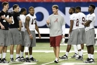 Dec 5, 2014; Atlanta, GA, USA;  Alabama Crimson Tide offensive coordinator Lane Kiffin works with quarterbacks and receivers during practice at the Georgia Dome. Alabama plays the Missouri Tigers in the SEC Championship on Saturday. Mandatory Credit: John