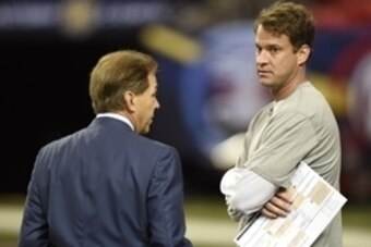 Dec 5, 2014; Atlanta, GA, USA; Alabama Crimson Tide head coach Nick Saban, left, talks with offensive coordinator Lane Kiffin duing practice at the Georgia Dome. Alabama plays the Missouri Tigers in the SEC Championship on Saturday. Mandatory Credit: John