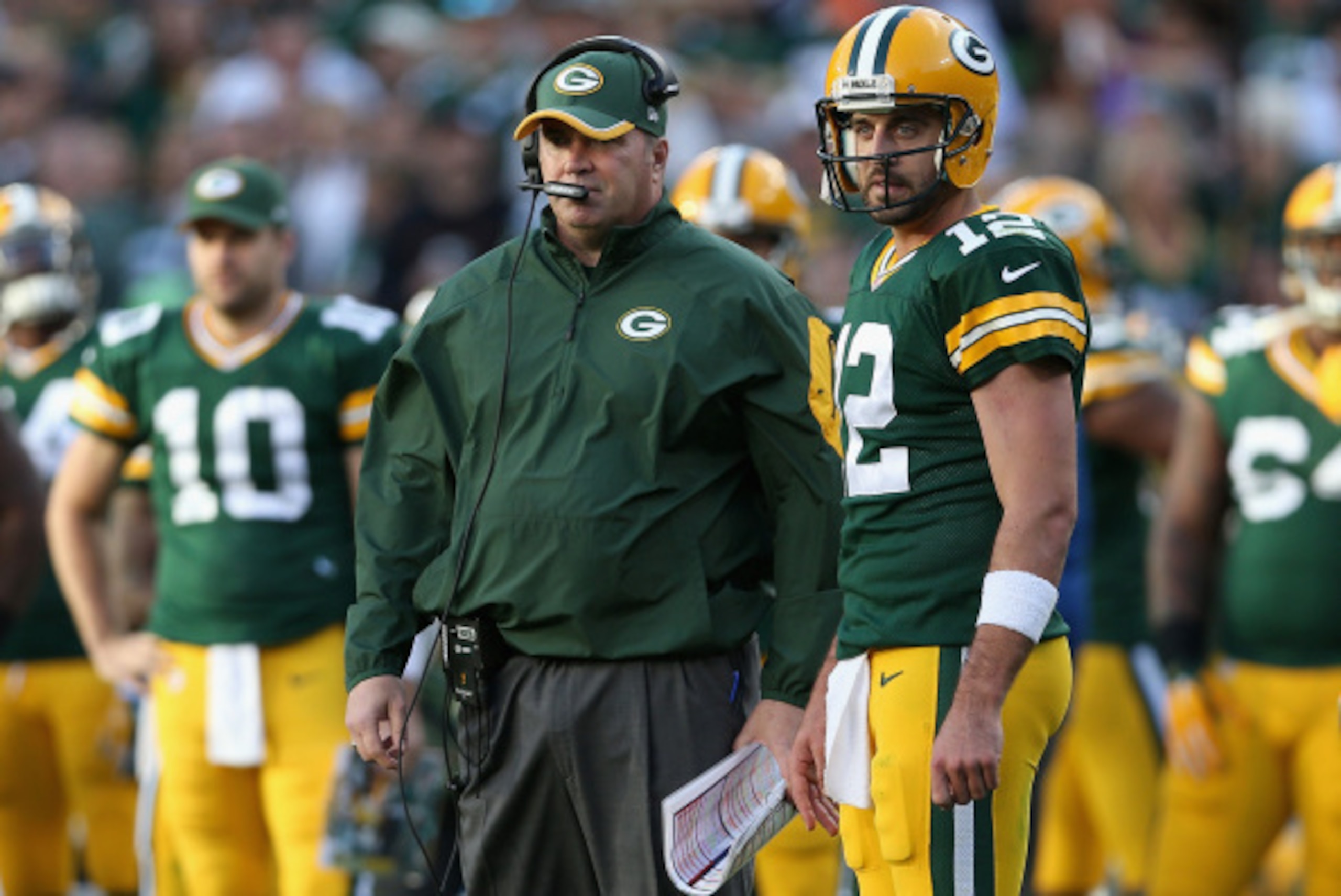 GREEN BAY, WI - SEPTEMBER 14:  Head coach Mike McCarthy and quarterback Aaron Rodgers #12 of the Green Bay Packers talk during the NFL game against the New York Jets at Lambeau Field on September 14, 2014 in Green Bay, Wisconsin. The Packers defeated the 