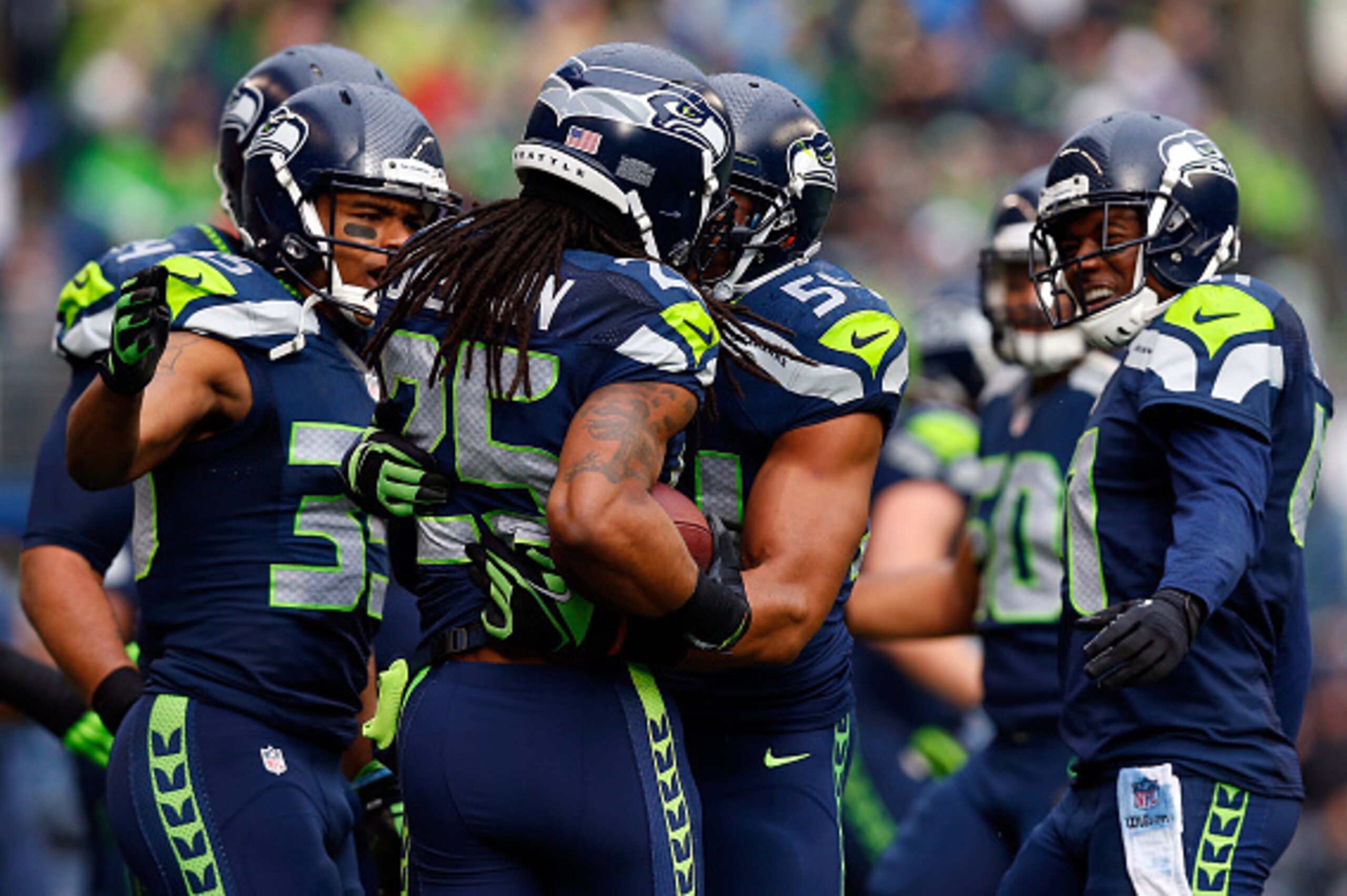 SEATTLE, WA - JANUARY 18: Richard Sherman #25 of the Seattle Seahawks celebrates with his teammates after intercepting a pass in the end zone during the first quarter of the 2015 NFC Championship game against the Green Bay Packers at CenturyLink Field on 