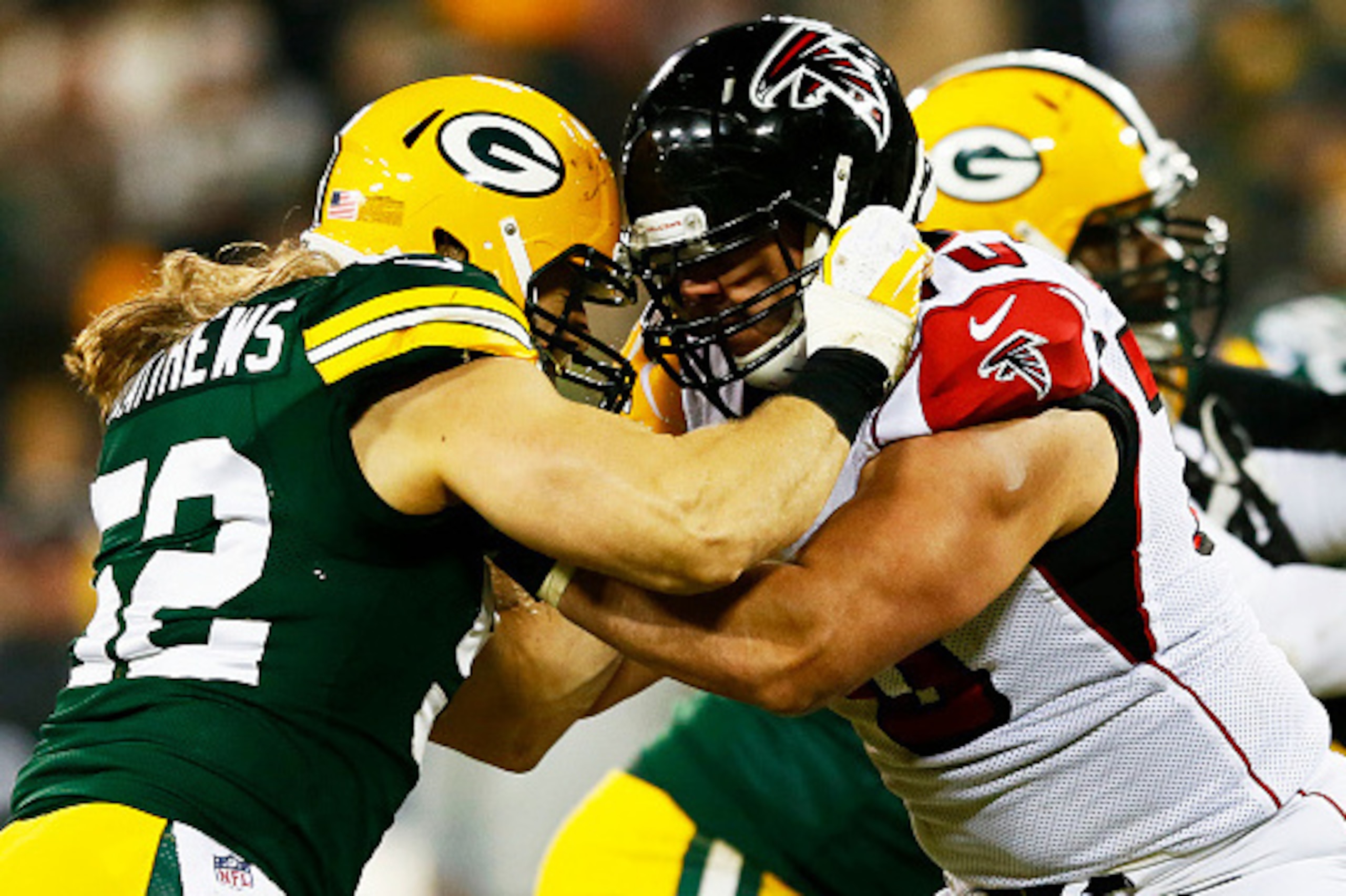 GREEN BAY, WI - DECEMBER 08:  Clay Matthews #52 of the Green Bay Packers defends against  Jake Matthews #70 of the Atlanta Falcons in the third quarter at Lambeau Field on December 8, 2014 in Green Bay, Wisconsin.  (Photo by Kevin C. Cox/Getty Images)
