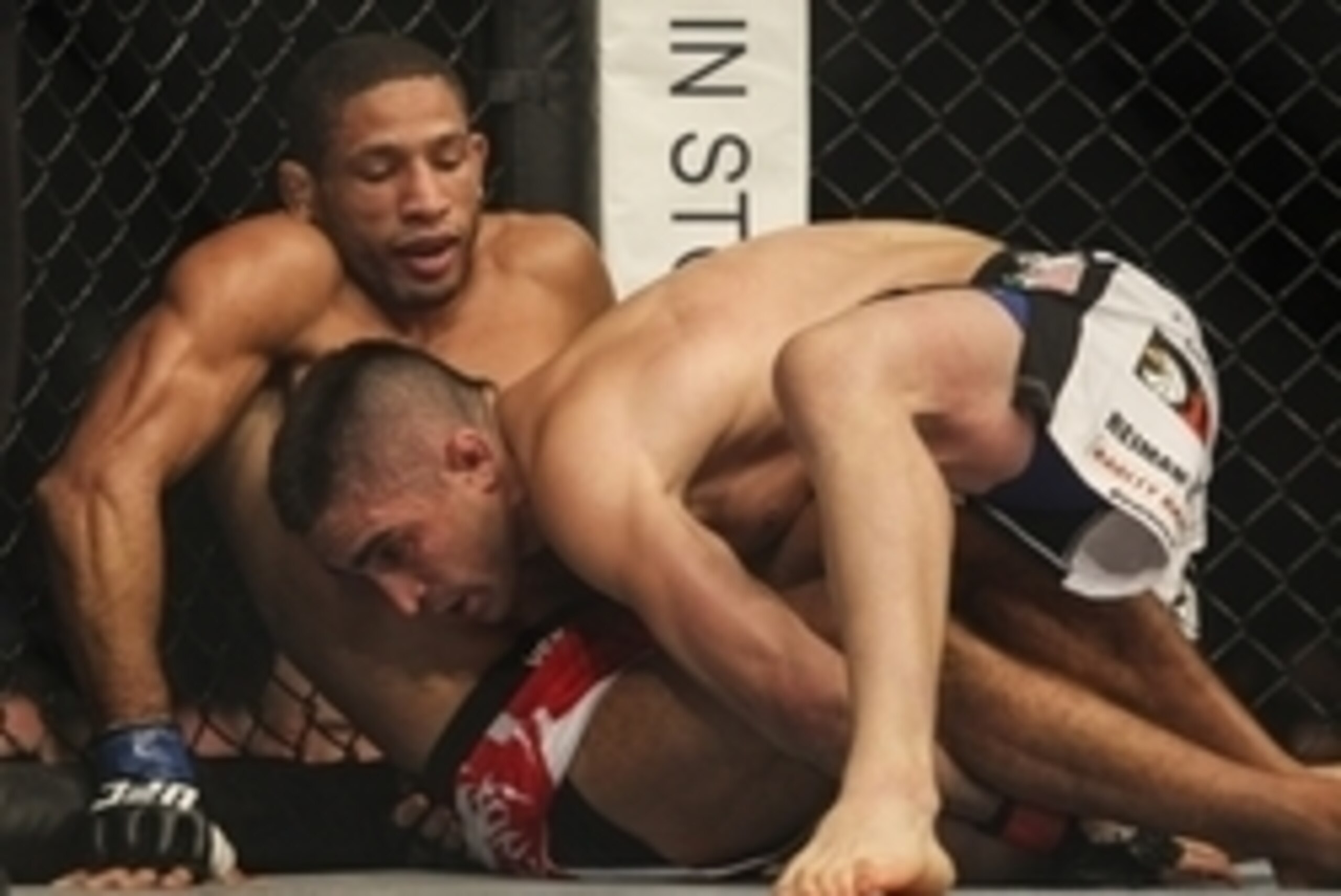 Jun 28, 2014; San Antonio, TX, USA; Ricardo Lamas (red gloves) fights Hacran Dias (blue gloves) in a Featherweight bout at UFC Fight Night 43 at AT&T Center. Mandatory Credit: Troy Taormina-USA TODAY Sports