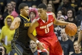 Jan 6, 2015; Minneapolis, MN, USA; Ohio State Buckeyes guard D'Angelo Russell (0) looks to drive to the basket past Minnesota Golden Gophers guard Nate Mason (2) in the second half at Williams Arena. The Buckeyes won 74-72 in overtime. Mandatory Credit: J