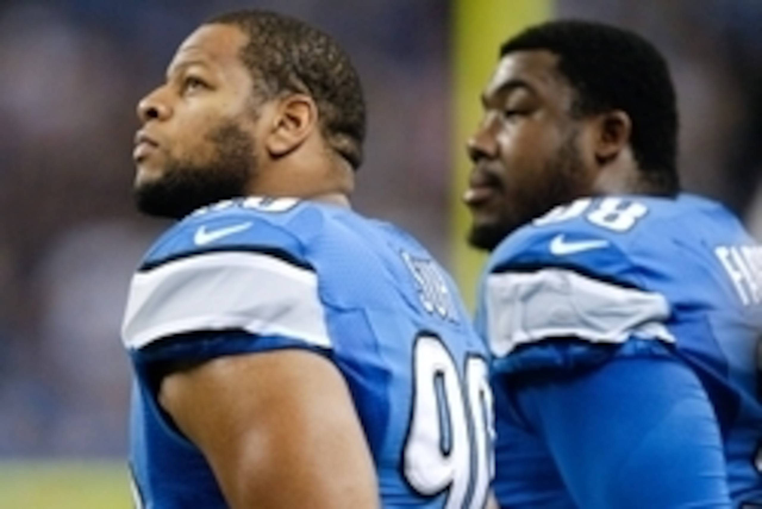 Dec 22, 2013; Detroit, MI, USA; Detroit Lions defensive tackle Ndamukong Suh (90) and defensive tackle Nick Fairley (98) listen to the national anthem before the game against the New York Giants at Ford Field. Giants beat the Lions 23-20. Mandatory Credit