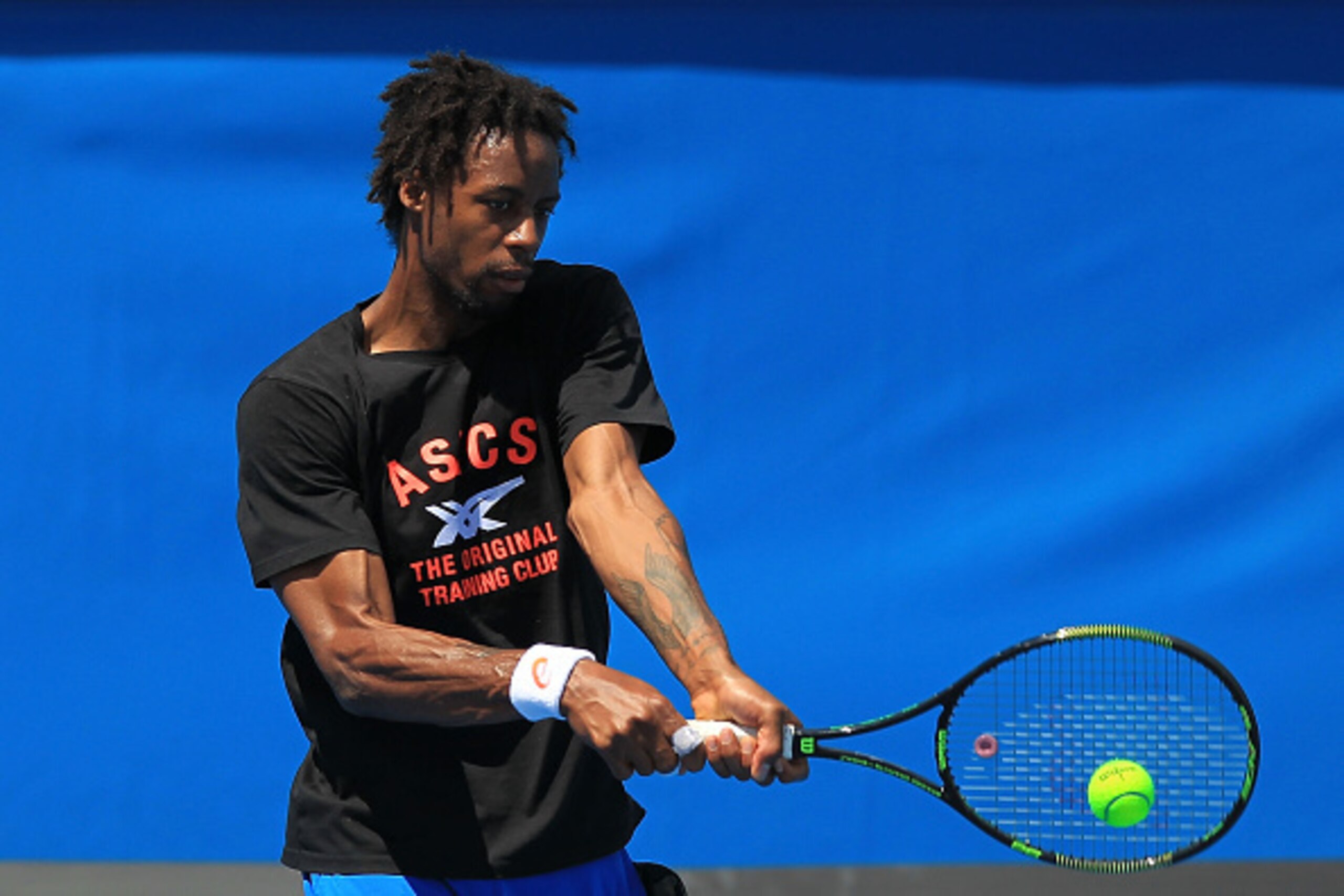 MELBOURNE, AUSTRALIA - JANUARY 11:  Gael Monfils of France plays a backhand during a training session ahead of the 2015 Australian Open at Melbourne Park on January 11, 2015 in Melbourne, Australia.  (Photo by Graham Denholm/Getty Images)