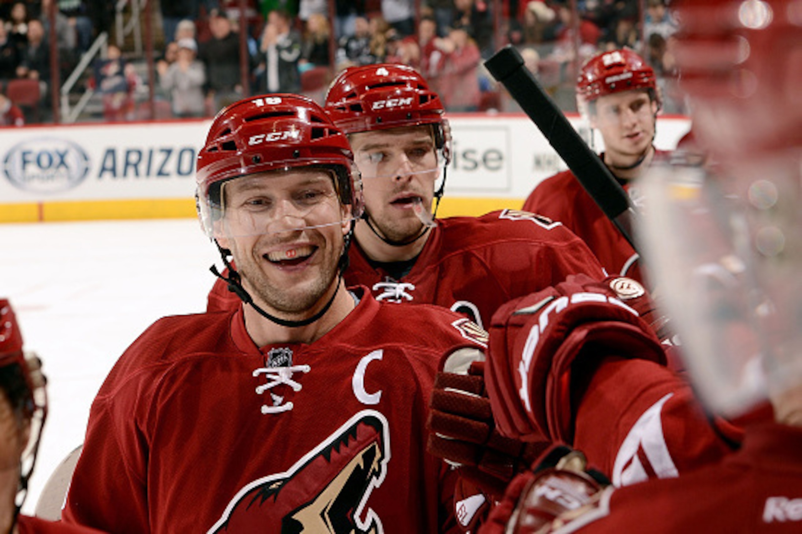 GLENDALE, AZ - JANUARY 13:  Shane Doan #19 of the Arizona Coyotes is congratulated by teammates after his second period goal against the San Jose Sharks at Gila River Arena on January 13, 2015 in Glendale, Arizona.  (Photo by Norm Hall/NHLI via Getty Imag