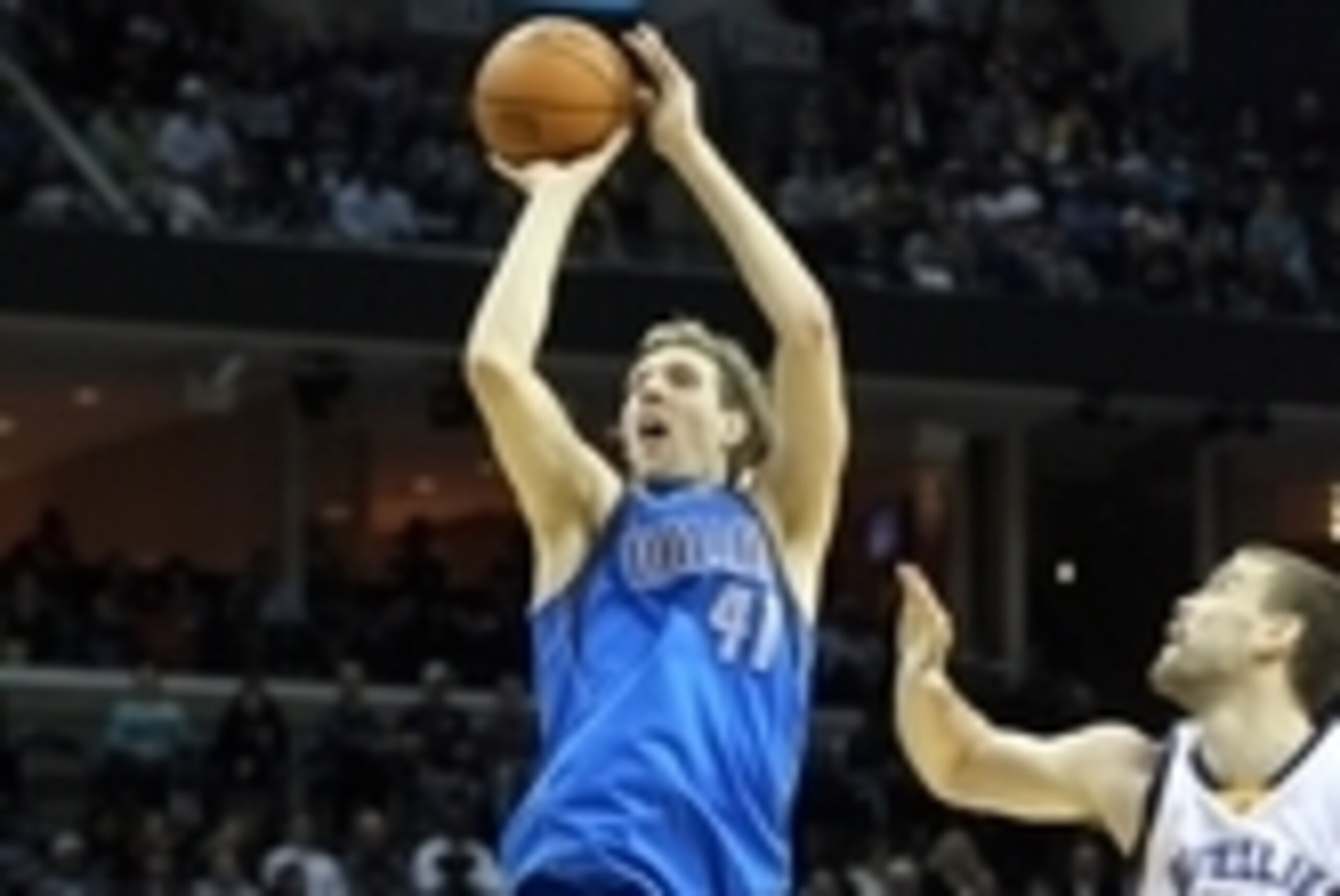Jan 19, 2015; Memphis, TN, USA; Dallas Mavericks forward Dirk Nowitzki (41) attempts a shot as Memphis Grizzlies center Marc Gasol (33) looks on at FedExForum. Dallas defeated Memphis 103-95. Mandatory Credit: Nelson Chenault-USA TODAY Sports