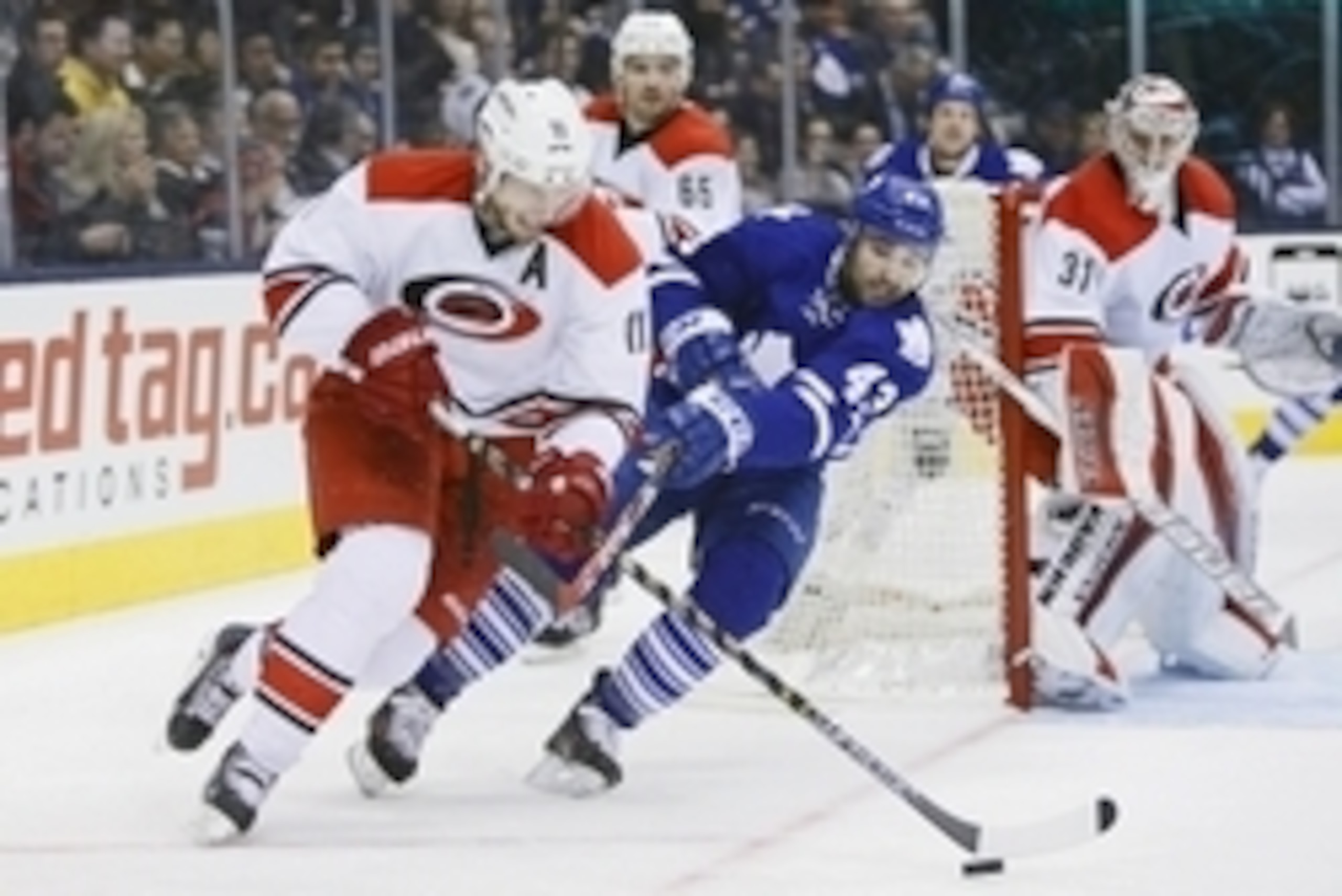 Jan 19, 2015; Toronto, Ontario, CAN; (editors note: caption correction) Toronto Maple Leafs forward Nazem Kadri (43) tries to knock the puck away from Carolina Hurricanes forward Jordan Staal (11) as goaltender Anton Khudobin (31) looks on during the seco Jan 19, 2015; Toronto, Ontario, CAN; (editors note: caption correction) Toronto Maple Leafs forward Nazem Kadri (43) tries to knock the puck away from Carolina Hurricanes forward Jordan Staal (11) as goaltender Anton Khudobin (31) looks on during the seco