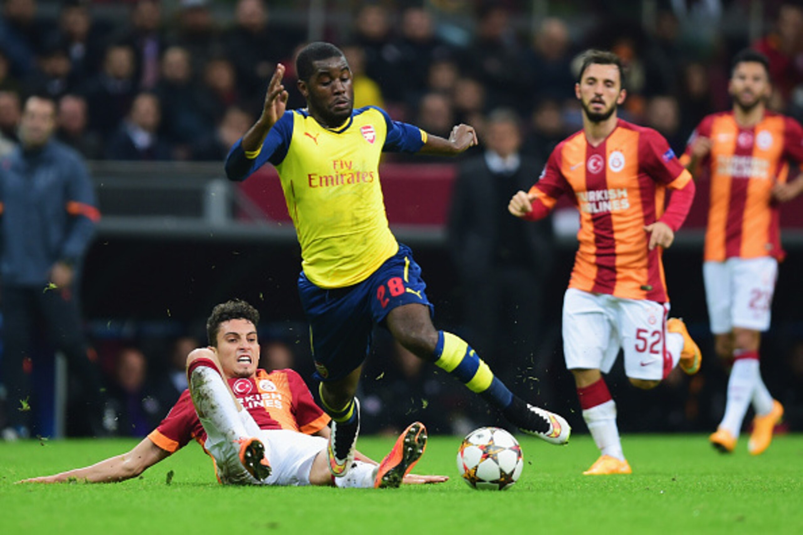 ISTANBUL, TURKEY - DECEMBER 09:  Joel Campbell of Arsenal is tackled by Alex Telles of Galatasaray during the UEFA Champions League Group D match between Galatasaray AS and Arsenal FC at Ali Sami Yen Arena on December 9, 2014 in Istanbul, Turkey.  (Photo 