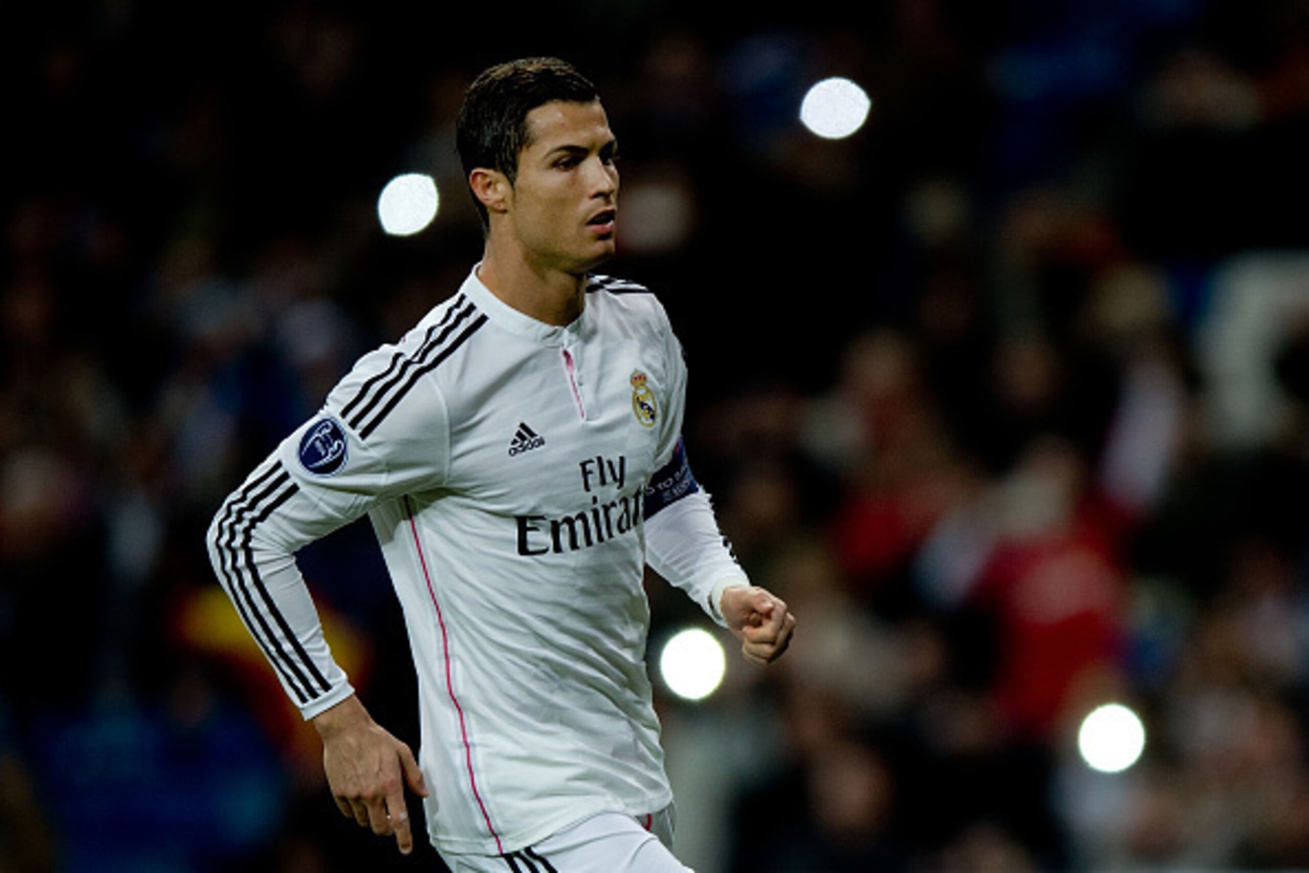 MADRID, SPAIN - DECEMBER 09: Cristiano Ronaldo of Real Madrid CF runs celebrating scoring his opening goal during the UEFA Champions League Group B match between Real Madrid CF and PFC Ludogorets Razgrad at Estadio Santiago Bernabeu on December 9, 2014 in