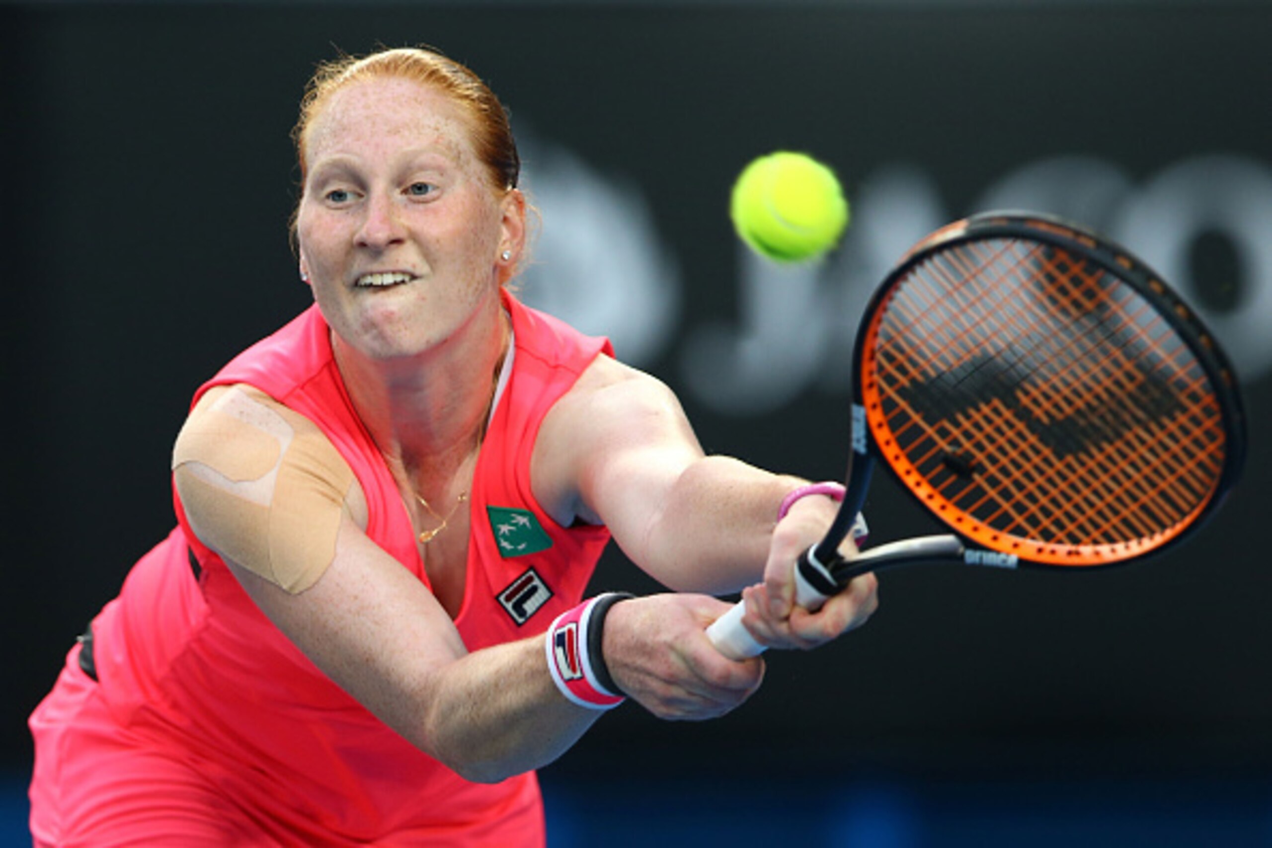 MELBOURNE, AUSTRALIA - JANUARY 20:  Alison Van Uytvanck of Belgium plays a backhand in her first round match against Serena Williams of the United States during day two of the 2015 Australian Open at Melbourne Park on January 20, 2015 in Melbourne, Austra