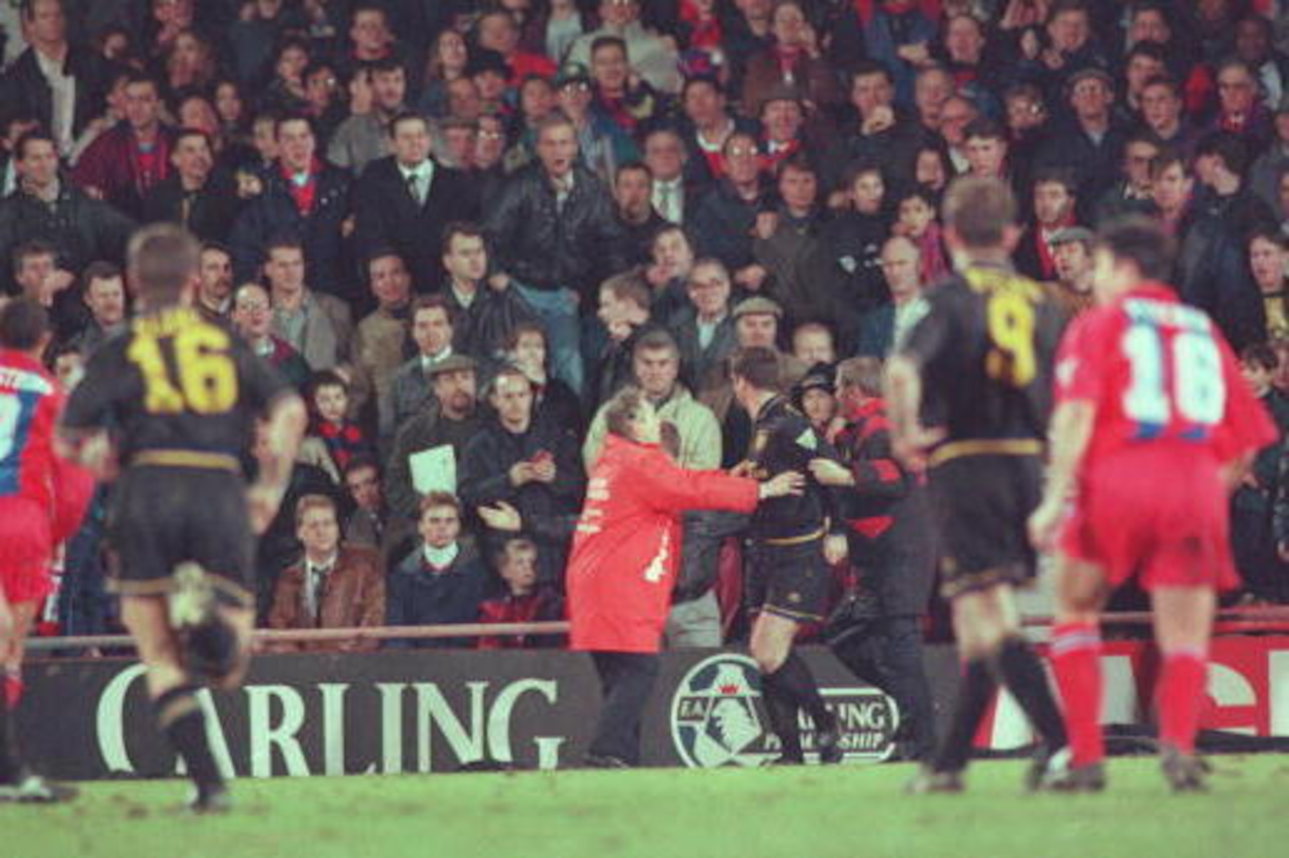 25 JAN 1995:  ERIC CANTONA OF MANCHESTER UNITED IS INVOLVED IN A FIGHT WITH A FAN AFTER HE WAS SENT OFF DURING THE CRYSTAL PALACE V MANCHESTER UNITED MATCH AT SELHURST PARK. Mandatory Credit: Shaun Botterill/ALLSPORT