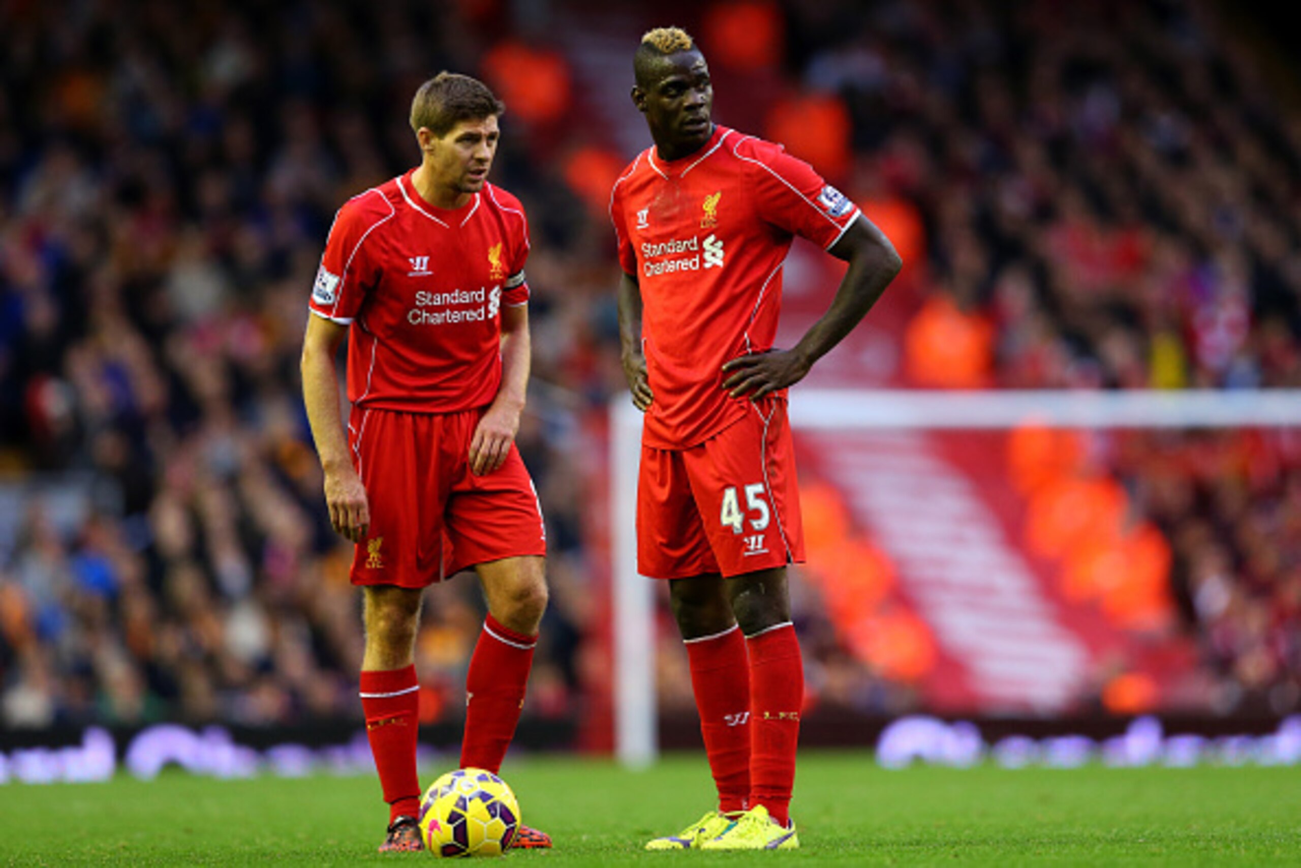 LIVERPOOL, ENGLAND - OCTOBER 25:  Steven Gerrard of Liverpool speaks with team-mate Mario Balotelli during the Barclays Premier League match between Liverpool and Hull City at Anfield on October 25, 2014 in Liverpool, England.  (Photo by Alex Livesey/Gett