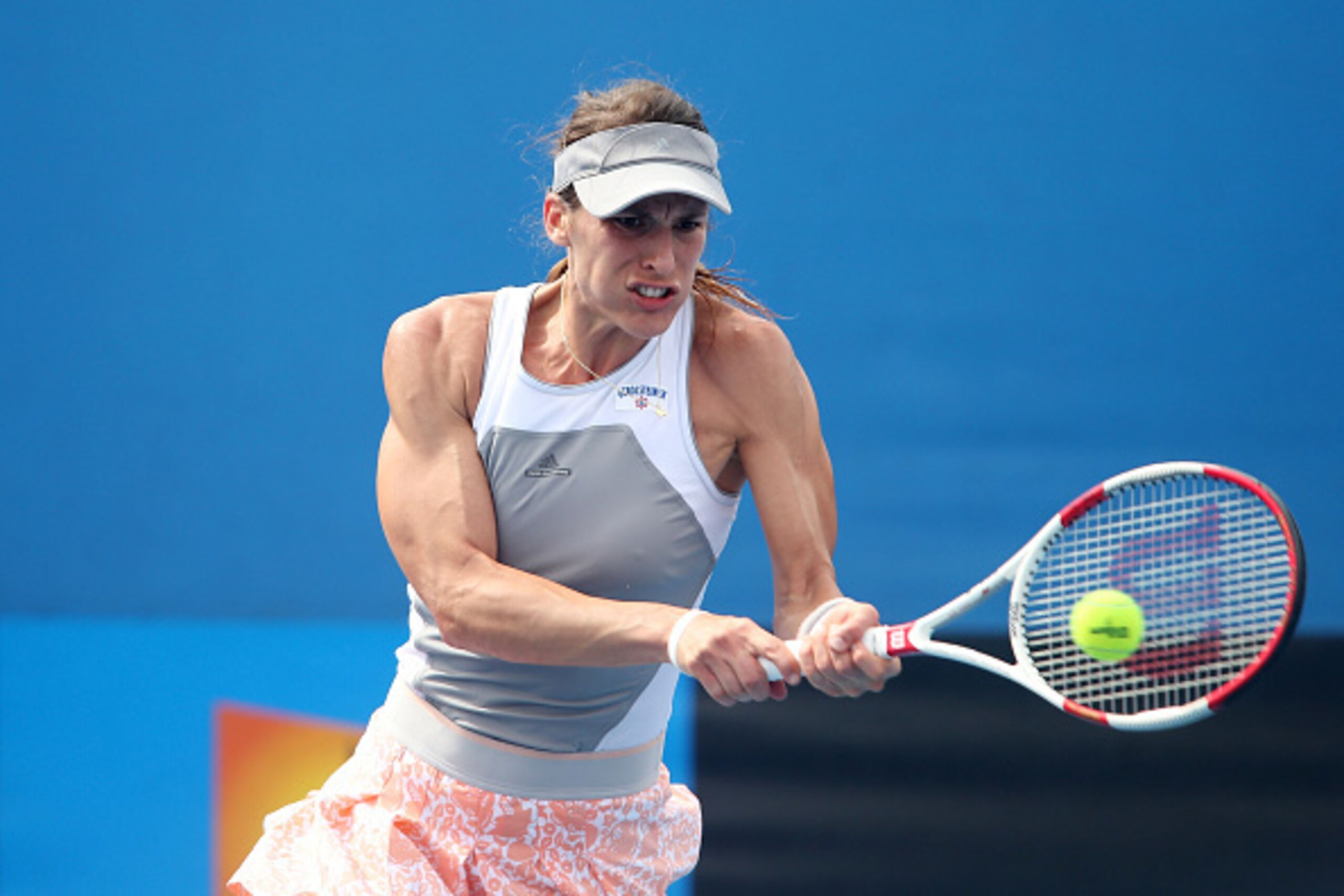 MELBOURNE, AUSTRALIA - JANUARY 20:  Andrea Petkovic of Germany plays a backhand in her first round match against Madison Brengle of the United States during day two of the 2015 Australian Open at Melbourne Park on January 20, 2015 in Melbourne, Australia.