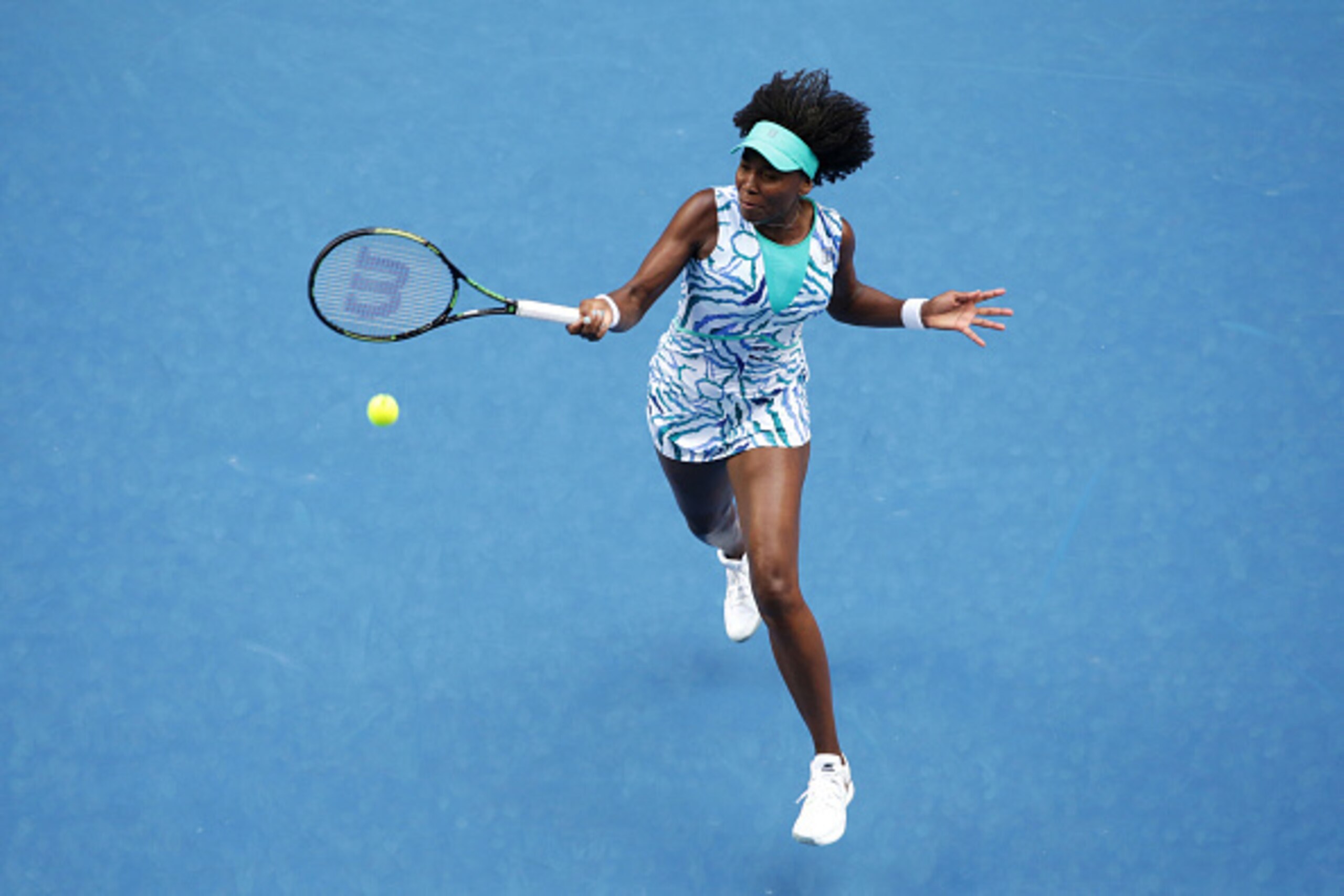 MELBOURNE, AUSTRALIA - JANUARY 20:  Venus Williams of the United States plays a forehand in her first round match against Maria-Teresa Torro-Flor of Spain during day two of the 2015 Australian Open at Melbourne Park on January 20, 2015 in Melbourne, Austr