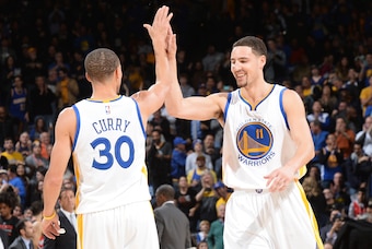 OAKLAND, CA - JANUARY 2: Stephen Curry #30 and Klay Thompson #11 of the Golden State Warriors celebrate during the game against the Toronto Raptors on January 2, 2015 at Oracle Arena in Oakland, California. NOTE TO USER: User expressly acknowledges and ag