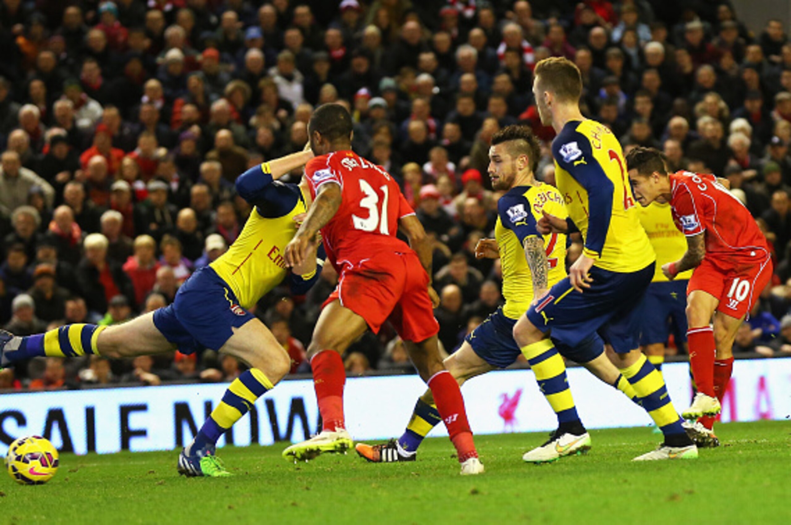 LIVERPOOL, ENGLAND - DECEMBER 21: Philippe Coutinho of Liverpool scores the opening goal during the Barclays Premier League match between Liverpool and Arsenal at Anfield on December 21, 2014 in Liverpool, England.  (Photo by Alex Livesey/Getty Images)