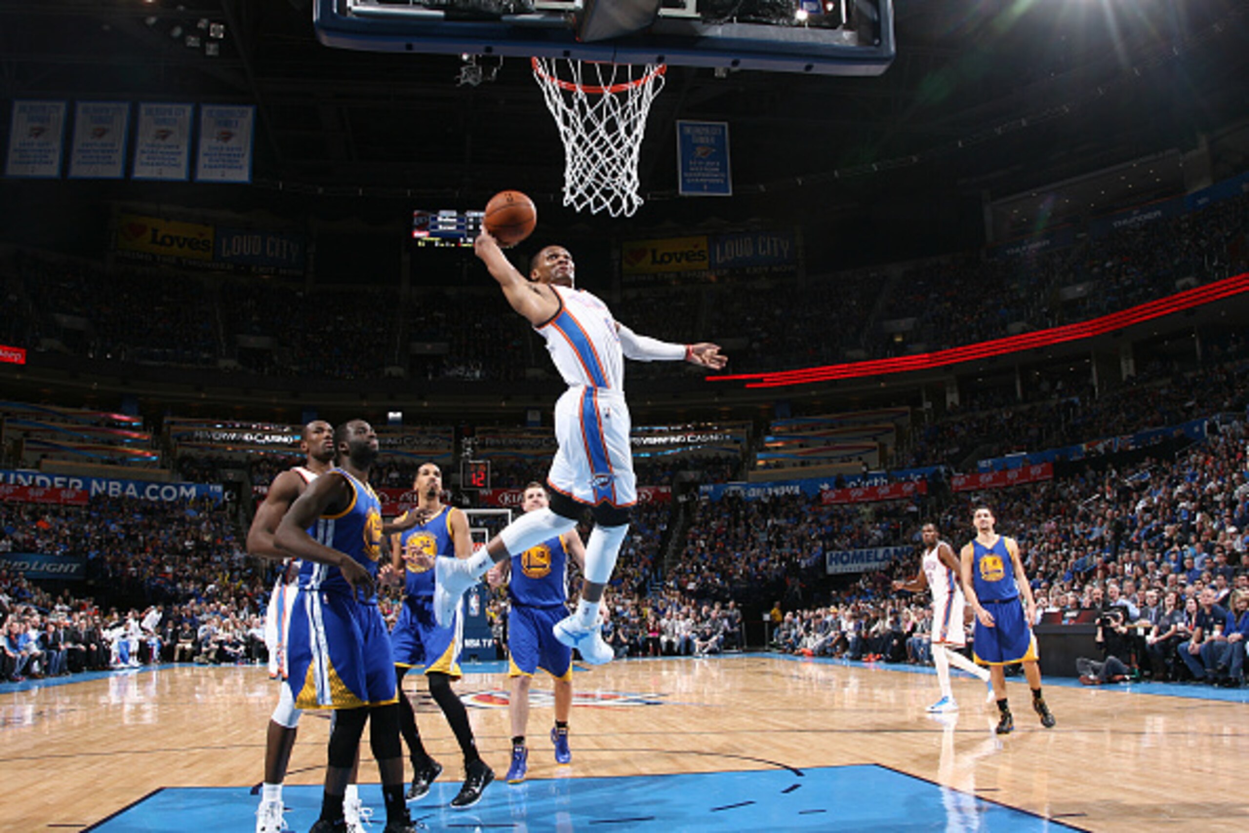 OKLAHOMA CITY, OK- JANUARY 16: Russell Westbrook #0 of the Oklahoma City Thunder dunks against the Golden State Warriors on January 16, 2015 at Chesapeake Energy Arena in Oklahoma City, OK. NOTE TO USER: User expressly acknowledges and agrees that, by dow