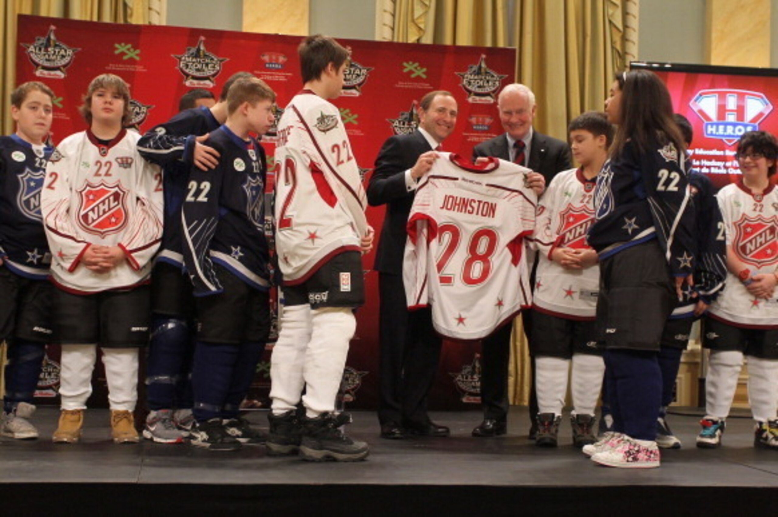 OTTAWA, ON - JANUARY 28:  NHL Commissioner Gary Bettman presents Governor General of Canada David Johnston a jersey during the 2012 NHL All-Star Game - H.E.R.O.S. Community Program Launch at Rideau Hall on January 28, 2012 in Ottawa, Ontario, Canada.  (Ph