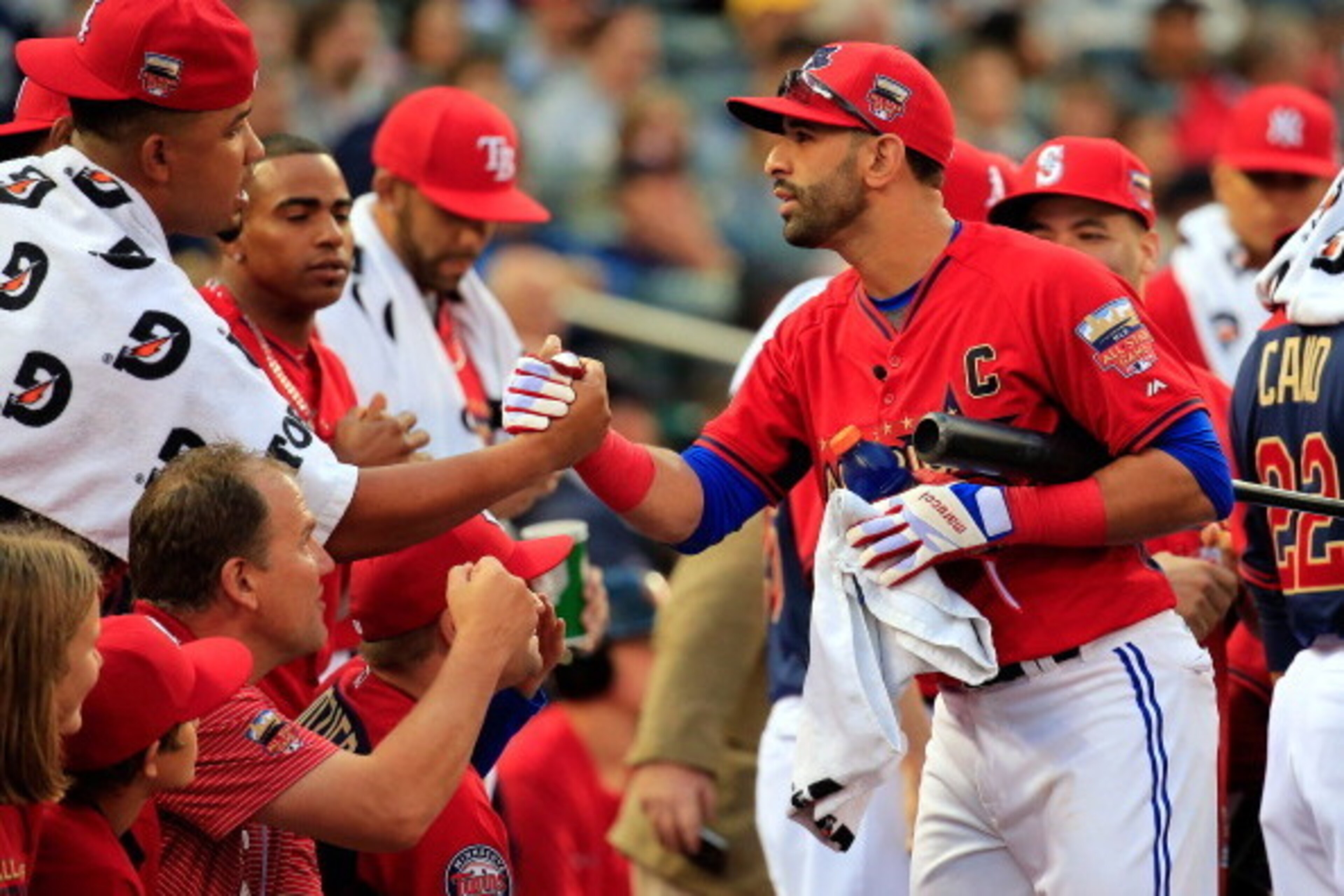 MINNEAPOLIS, MN - JULY 14:  American League All-Star Jose Bautista #19 of the Toronto Blue Jays celebrates with teammates during the Gillette Home Run Derby at Target Field on July 14, 2014 in Minneapolis, Minnesota.  (Photo by Rob Carr/Getty Images)