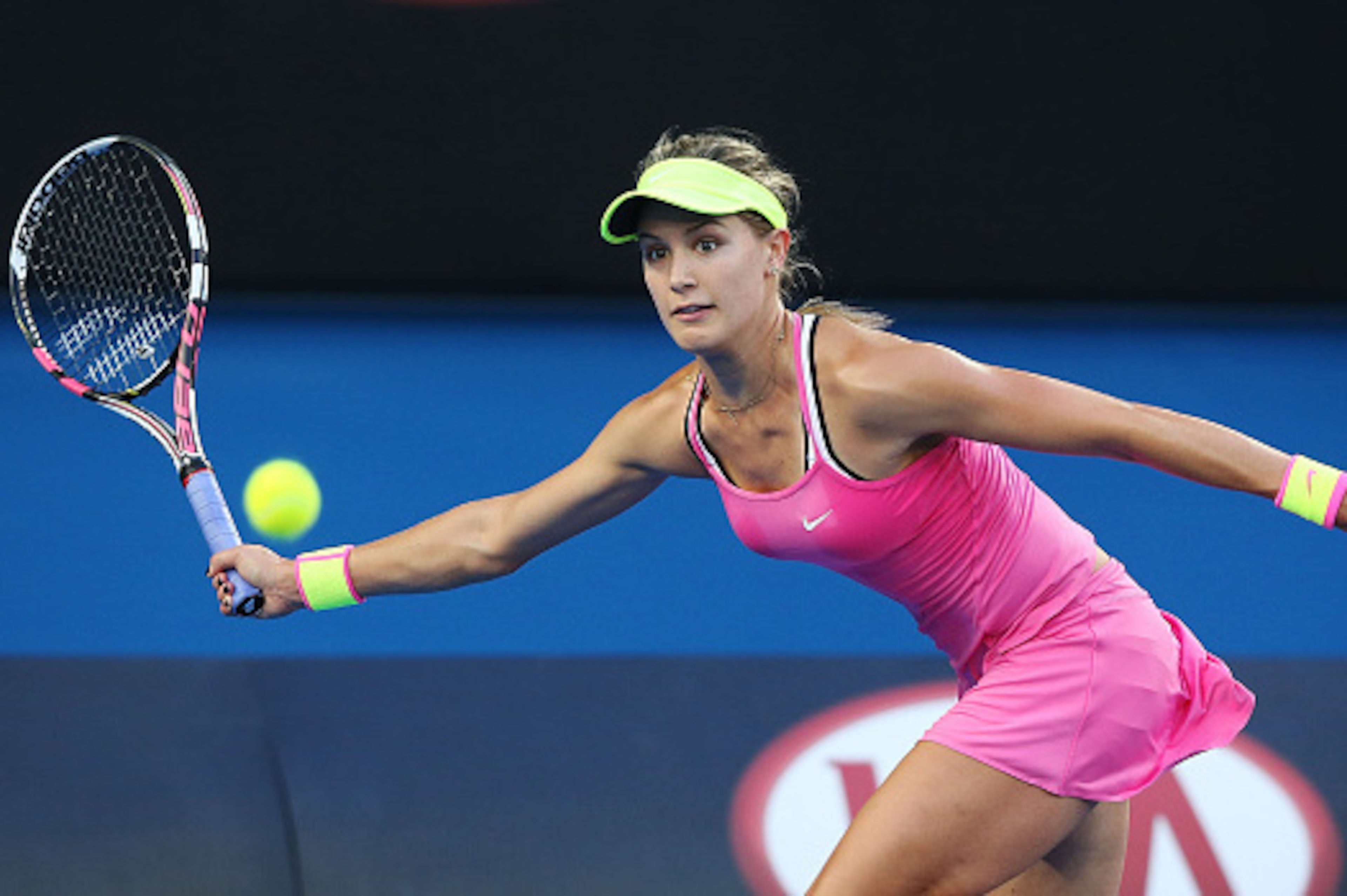 MELBOURNE, AUSTRALIA - JANUARY 19:  Eugenie Bouchard of Canada plays a forehand against her first round match against Anna-Lena Friedsam of Germany during day one of the 2015 Australian Open at Melbourne Park on January 19, 2015 in Melbourne, Australia.  