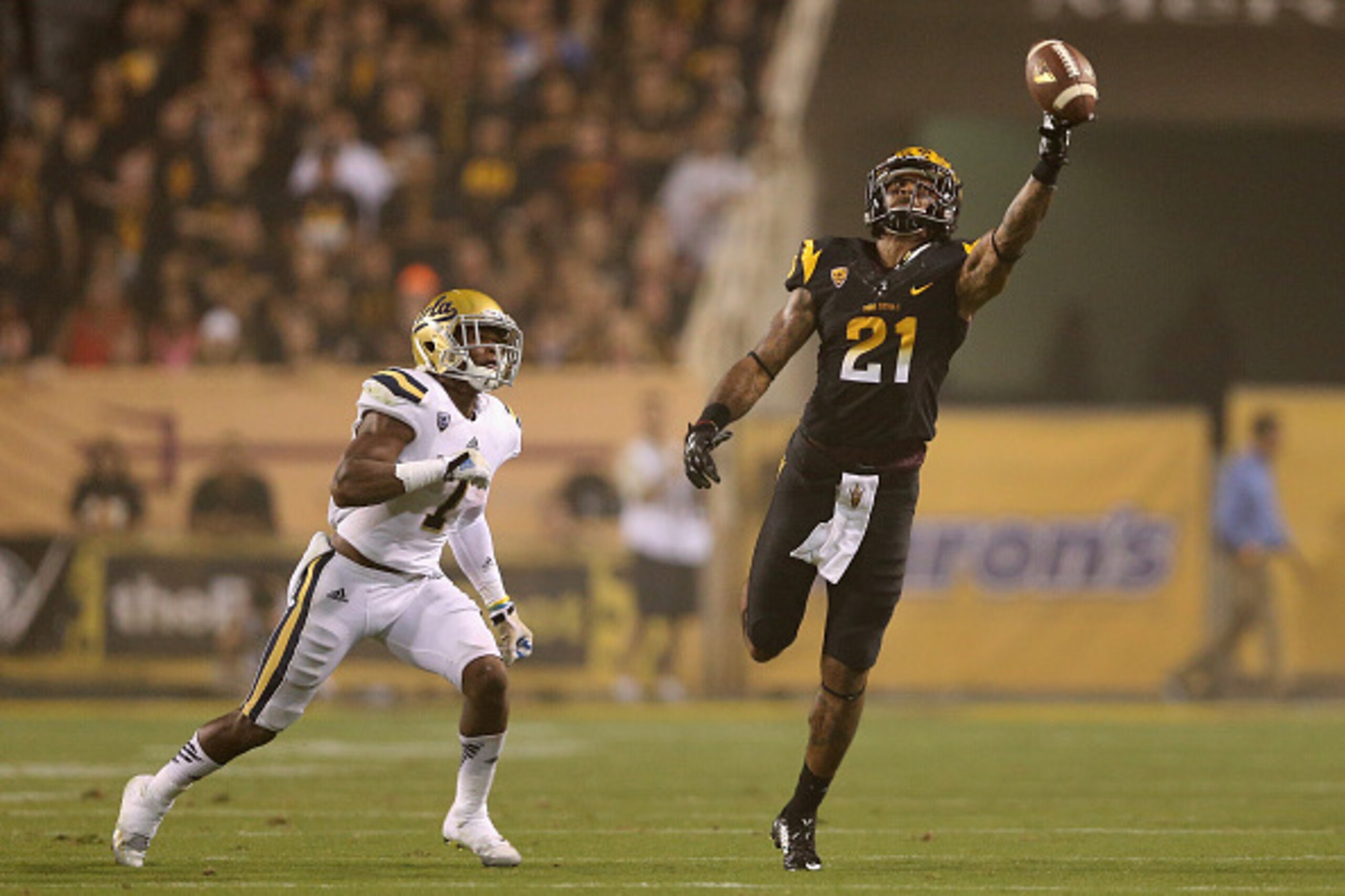 TEMPE, AZ - SEPTEMBER 25:  Wide receiver Jaelen Strong #21 of the Arizona State Sun Devils attempts to make a catch on an incomplete pass over defensive back John Johnson #7 of the UCLA Bruins during the college football game at Sun Devil Stadium on Septe