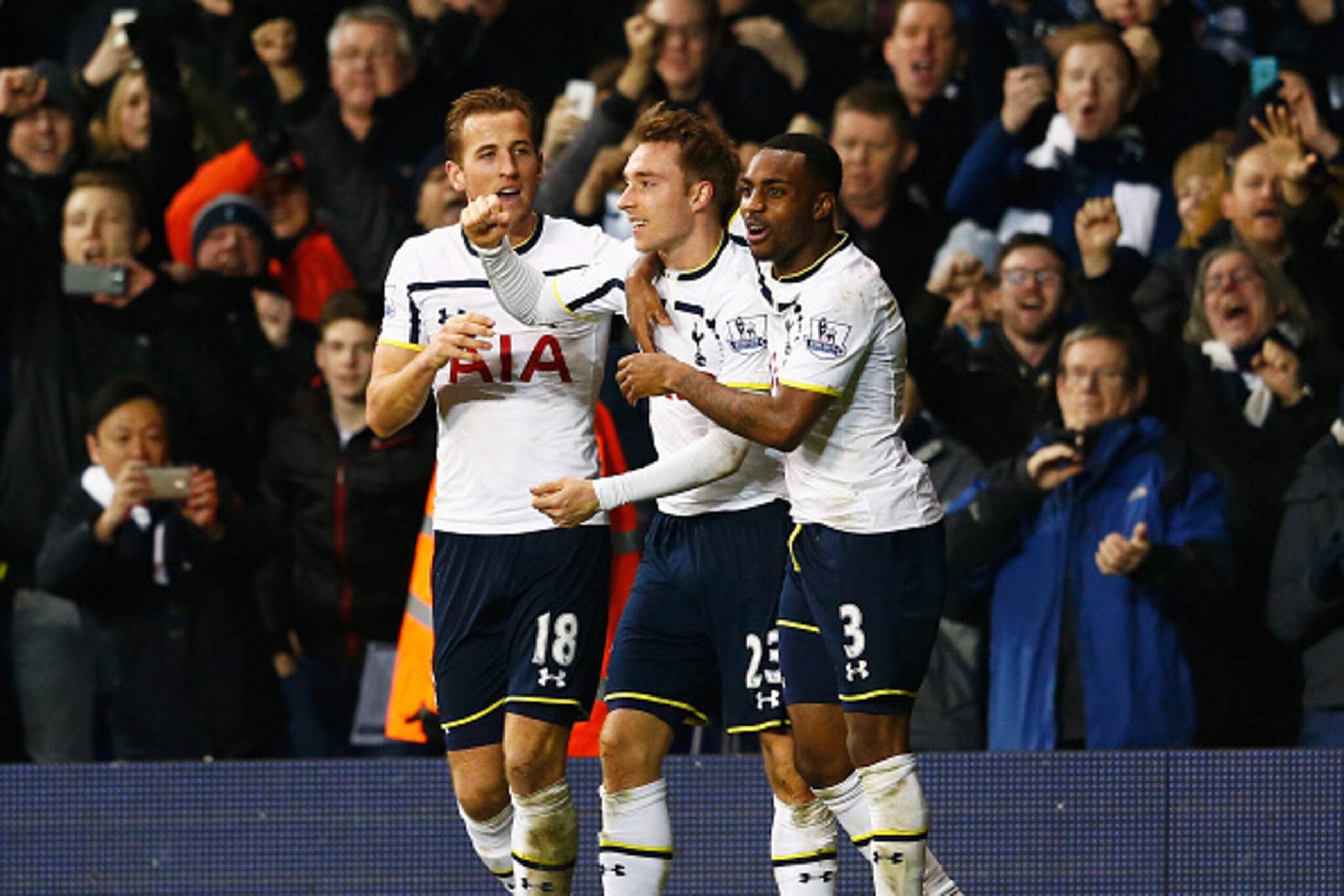 LONDON, ENGLAND - JANUARY 17:  Christian Eriksen (C) of Tottenham Hotspur celebrates scoring his team's second goal with Harry Kane (L) and Danny Rose during the Barclays Premier League match between Tottenham Hotspur and Sunderland at White Hart Lane on 